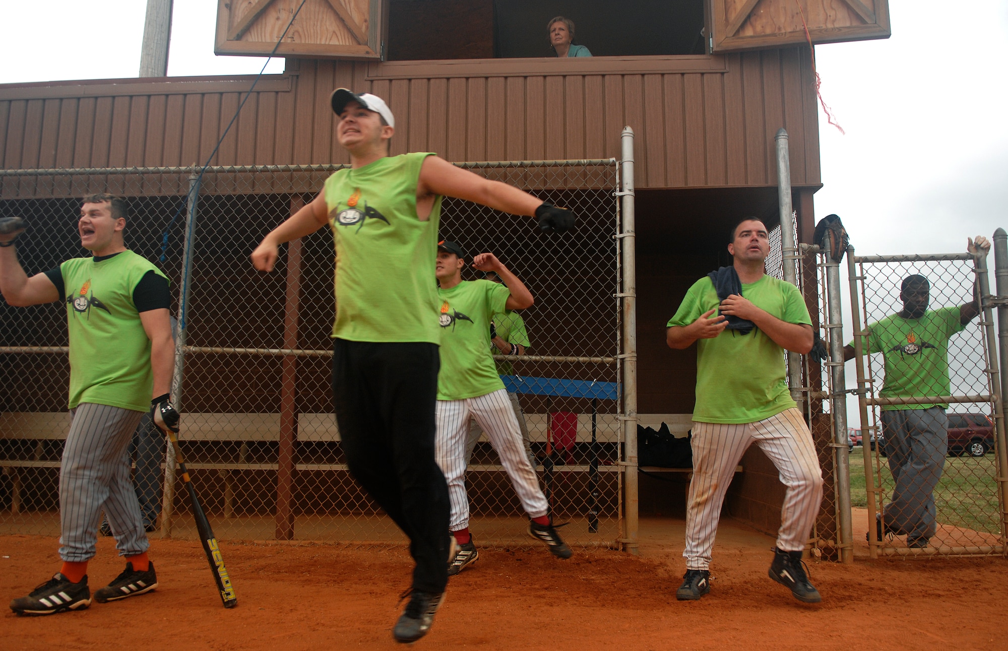 LANGLEY AIR FORCE BASE, Va. -- Members of the 1st Equipment Maintenance Squadron softball team react to a homerun hit during the softball championship game against the 1st Communications Squadron, Aug. 28.  The 1st CS handed 1st EMS its first loss of the year, 18-15, in the finale.  (U.S. Air Force photo/Senior Airman Vernon Young)