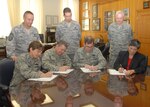 (Seated from left), Col. Jacqueline Van Ovost, 12th Flying Training Wing commander, Maj. Gen. Gregory Feest, 19th Air Force commander, Gen. Stephen Lorenz, Air Education and Training Command commander, and Sheila Earle, Air Force Personnel Center executive director, sign their 2008 Combined Federal Campaign contribution forms as (standing from left) Chief Master Sgts. Stephen Page, 12th FTW command chief, Robert Tappana, AETC command chief, and Richard Kaiser, AFPC command chief, look on. Team Randolph's Combined Federal Campaign will officially kick off Sept. 4 during a breakfast at the Randolph Enlisted Club. (U.S. Air Force photo by Rich McFadden)