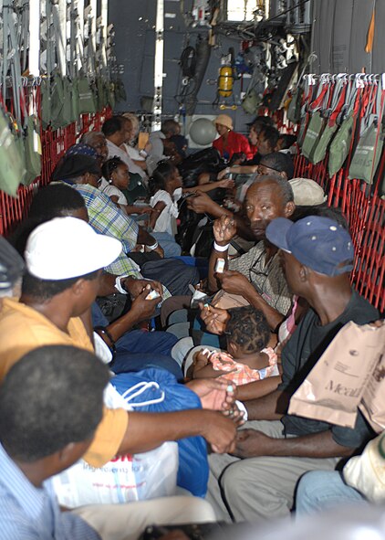 NEW ORLEANS INTERNATIONAL AIRPORT-- Hurricane Gustav evacuees await take off in a 317th Airlift Group C-130 from Dyess Air Force Base, Texas, August 31. Four C-130s and aircrews from Dyess AFB helped evacuate more than 6,500 New Orleans residents and more than 700 hospital patients. The evacuees were sent to different cities in Tennessee where relief teams were awaiting their arrival with food, water and shelter. (U.S. Air Force photo/ Senior Airman Jennifer Romig)