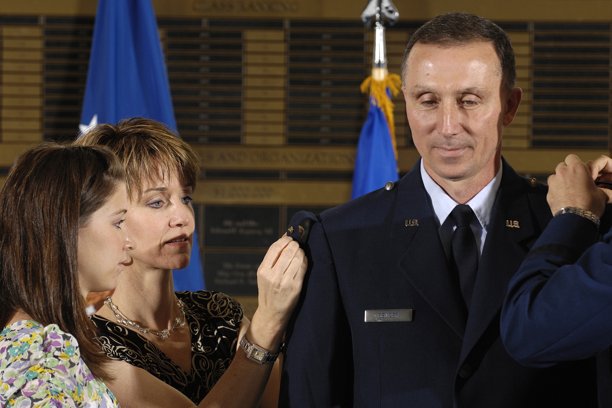 United States Air Force Col. Bill Bender, 86th Airlift Wing and Kaiserslautern Military Community commander, is pinned on by his daughter, Kristin (left), his wife, Sue, and his son, Matt, at the United States Air Force Academy, Colorado Springs, Colo., where Matt is a cadet third class. (U.S. Air Force photo by Michael Kaplan)(Released)