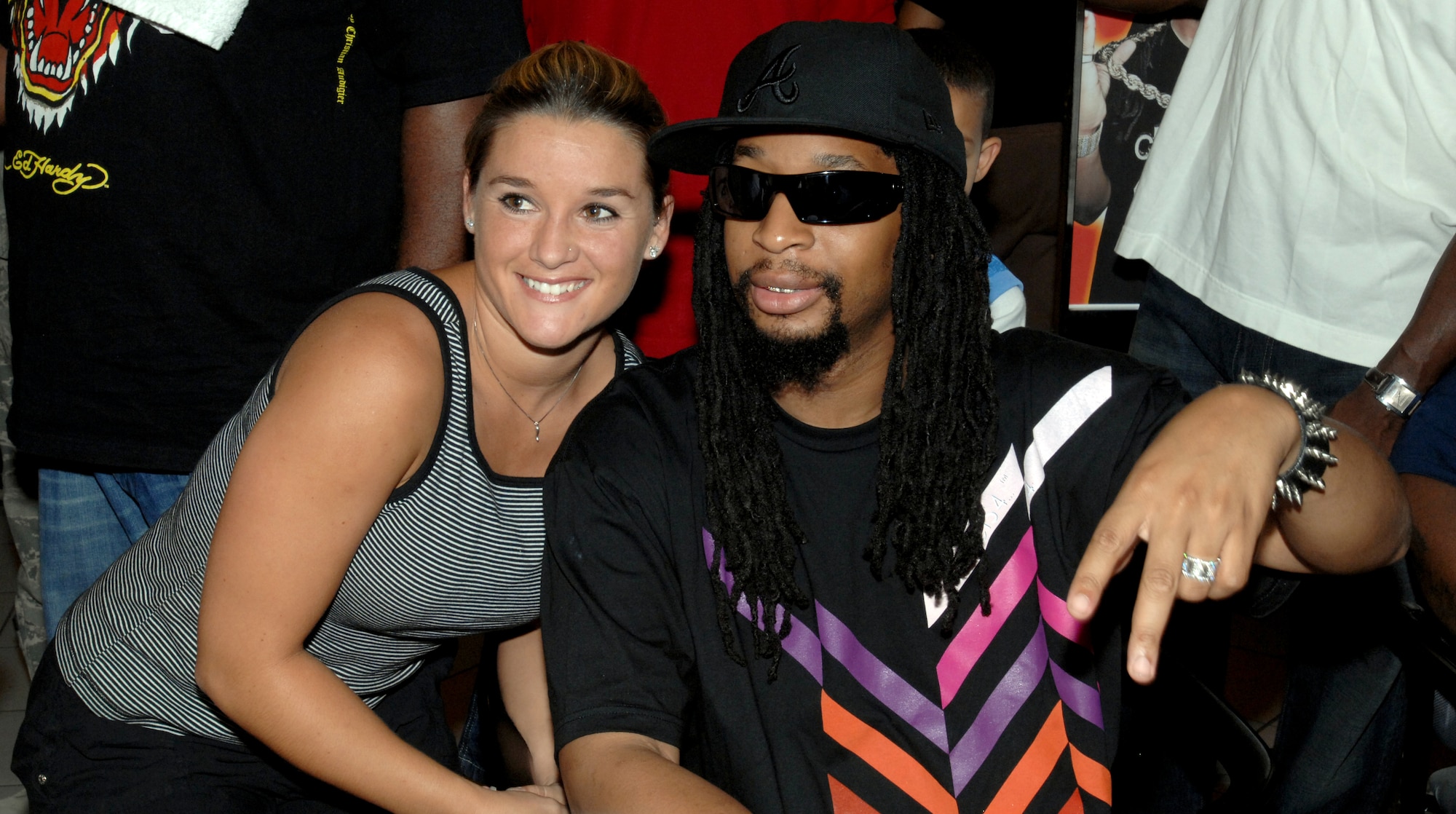 AVIANO AIR BASE, Italy --  Lil' Jon poses for a photo with fan Emily Owen at the BX Aug. 29.  Lil' Jon took time out of his European tour to visit and sign autographs for Airmen and their families at the BX.  (U.S. Air Force photo/Airman 1st Class Tabitha M. Mans).