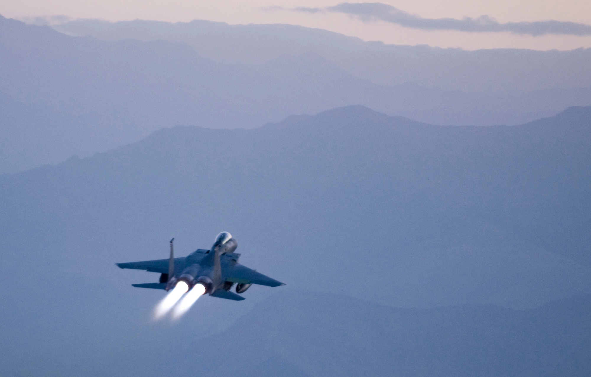 BAGRAM AIR FIELD, Afghanistan -- The roar of 50,000lbs of thrust greets the new day here August 27, 2008. The dawn patrol flew above the painted mountains, protecting coalition forces in their ever-vigilant close-air support mission. (U.S. Air Force photo by Staff Sgt. Samuel Morse/Released)