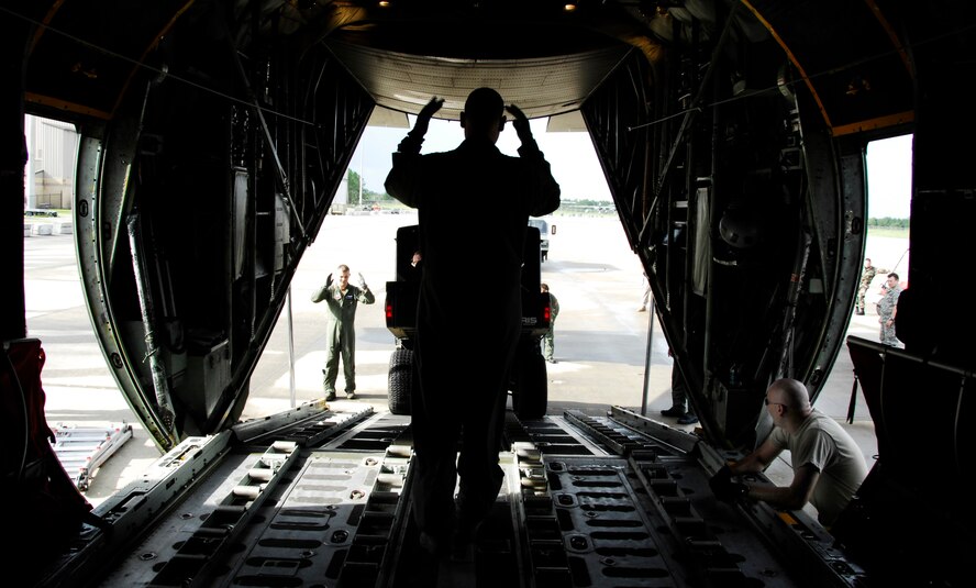 MOODY AIR FORCE BASE, Ga. -- A loadmaster with the 71st Rescue Squadron guides an all-terrain vehicle onto a 71st RQS C-130E Hercules here Sept. 1. The vehicle was a part of the 23rd Wing's response to aid victims of Hurricane Gustav. (U.S. Air Force photo by Tech. Sgt. Parker Gyokeres) 