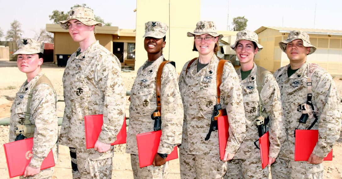 (From left to right) Petty Officer 2nd Class Serena Robertson, Petty Officer 2nd Class Joseph Collard, Petty Officer 2nd Class Shannon Boddie, Petty Officer 1st Class Joanne Saalfrank, Petty Officer 1st Class Beyonava Kendall and Petty Officer 1st Class Joseph Diaz were presented their Fleet Marine Force Warfare Specialist badges Sept. 2 as air traffic controllers attached to Marine Air Control Squadron 1. The 3rd Marine Aircraft Wing (Forward) squadron commanding officer, Lt. Col. Jeff Kojac, presented the sailors their badges during a ceremony held at the air traffic control tower. (U.S. Marine Corps Photo / Released)