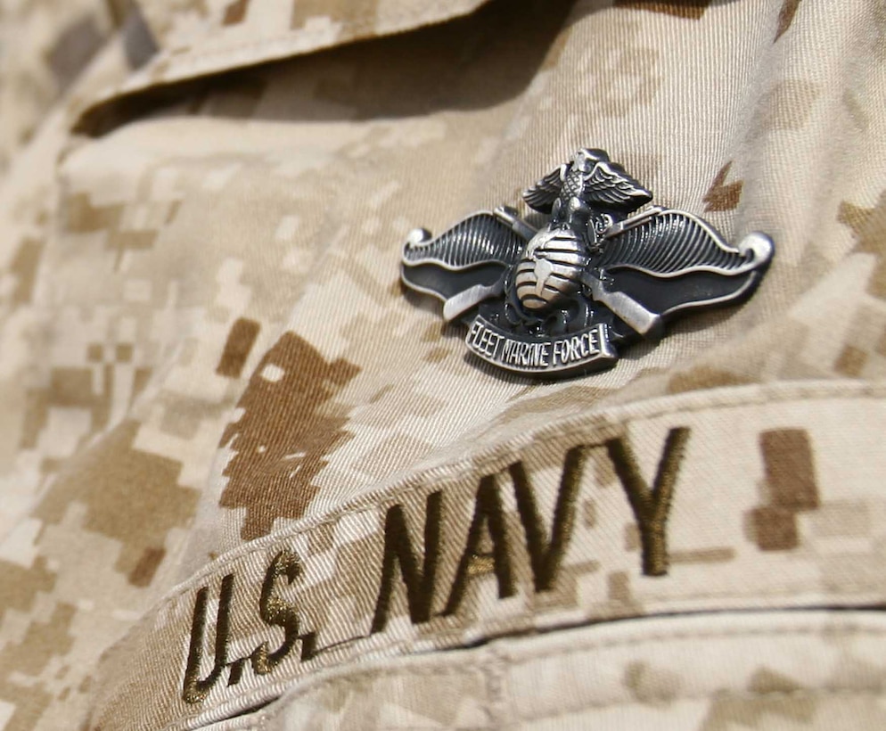 To wear a Fleet Marine Force Warfare Specialist badge, Sailors must learn different aspects of the Marine Corps to include passing a Marine physical fitness test, conducting close order drill and knowing the nomenclature and characteristics of weapons such as the M16-A2 service rifle, M9 pistol, and M240G machine gun. In addition, sailors must pass a 150-question examination covering everything they learned during the course. (U.S. Marine Corps Photo / Released)
