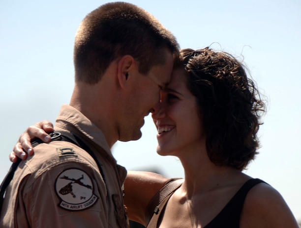 Capt. Brian Thomasson embraces his wife, Amanda, after arriving home to Charleston AFB Sept. 3. The 14th Airlift Squadron returned after a four-month deployment to Southwest Asia. Capt. Thomasson is with the 14 AS.  (U.S. Air Force Photo/Airman 1st Class Cynthia Spalding)