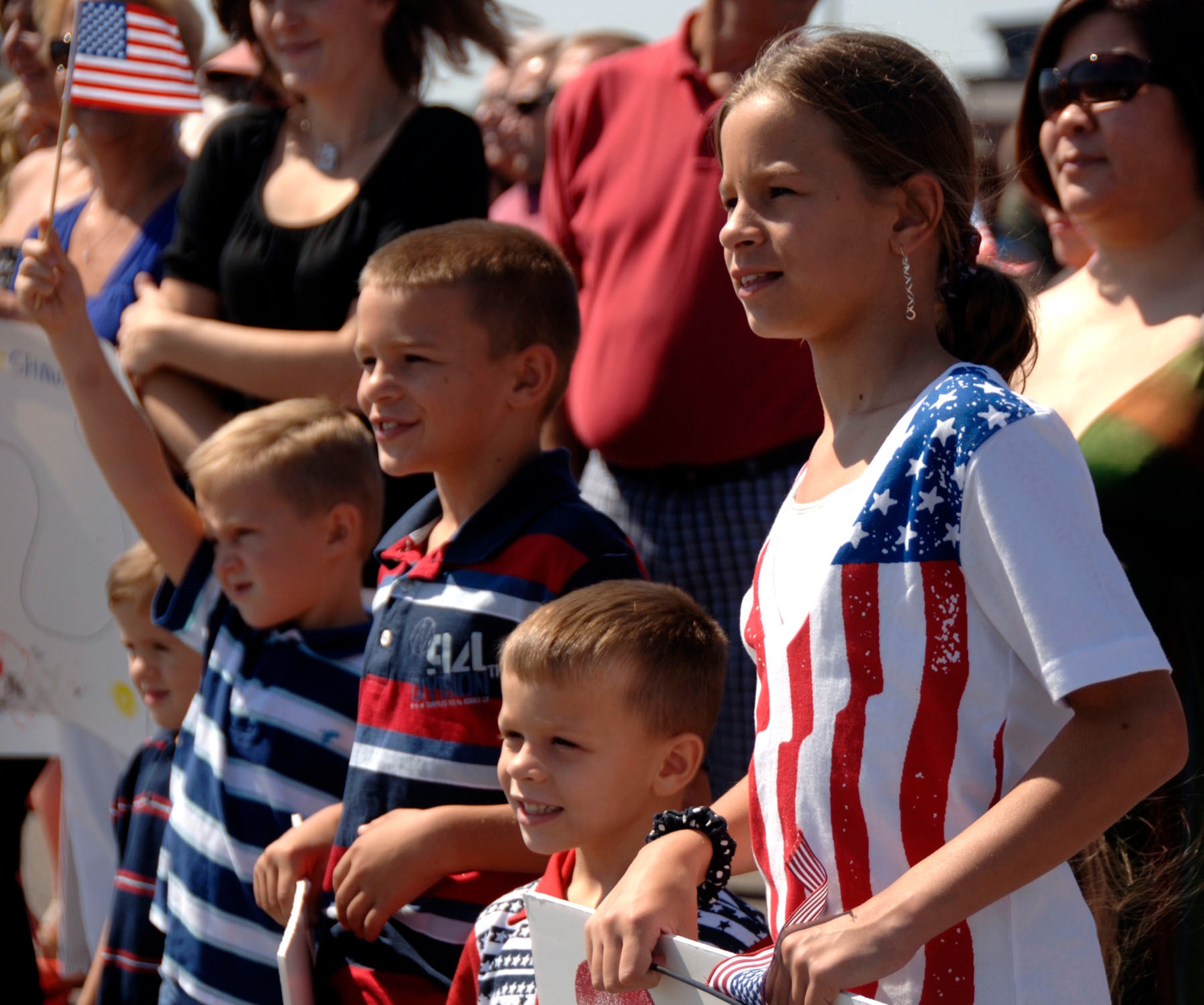 Children await the arrival of their returning parents on the Charleston AFB flightline Sept. 3. The 14th Airlift Squadron returned after a four-month deployment to Southwest Asia.  (U.S. Air Force Photo/Airman 1st Class Cynthia Spalding)