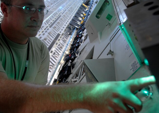 Tech. Sgt. Daniel Putzke checks a C-17 emergency light as part of his pre-flight inspection on the flightline Sept. 3. Pre-flight inspections are one of the most important procedures to help prevent aircraft malfunctions after takeoff. Sergeant Putzke is with the 315th Aircraft Maintenance Squadron. (U.S. Air Force photo/Airman 1st Class Timothy Taylor)