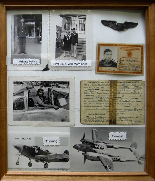 MINOT AIR FORCE BASE, N.D. – Shown here is a collage of photos and memorabilia from World War II veteran and living legend Elmer Wolf’s time in the Army Air Corps. The Living Legends group began with the donation of Mr. Wolf’s service-dress uniform. (U.S. Air Force photo by Senior Airman Kelly Timney)