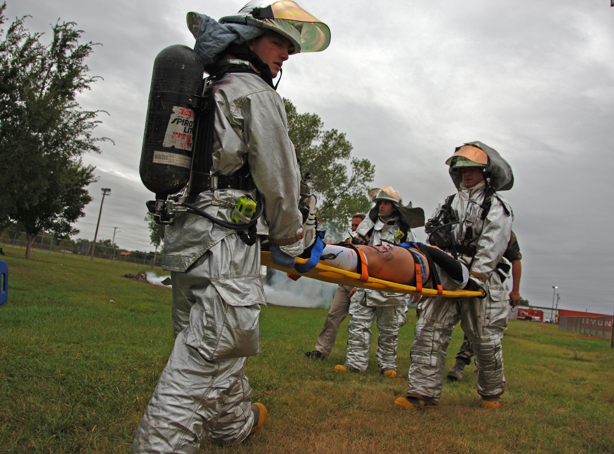 Rescue Airmen assigned to the 22nd Air Refueling Wing evacuate a simulated aircraft crash victim during a major accident response exercise just outside McConnell Air Force Base, Kan., on Sept 3. Several Airmen from the 931st Air Refueling Group worked with the 22nd in support of the exercise.