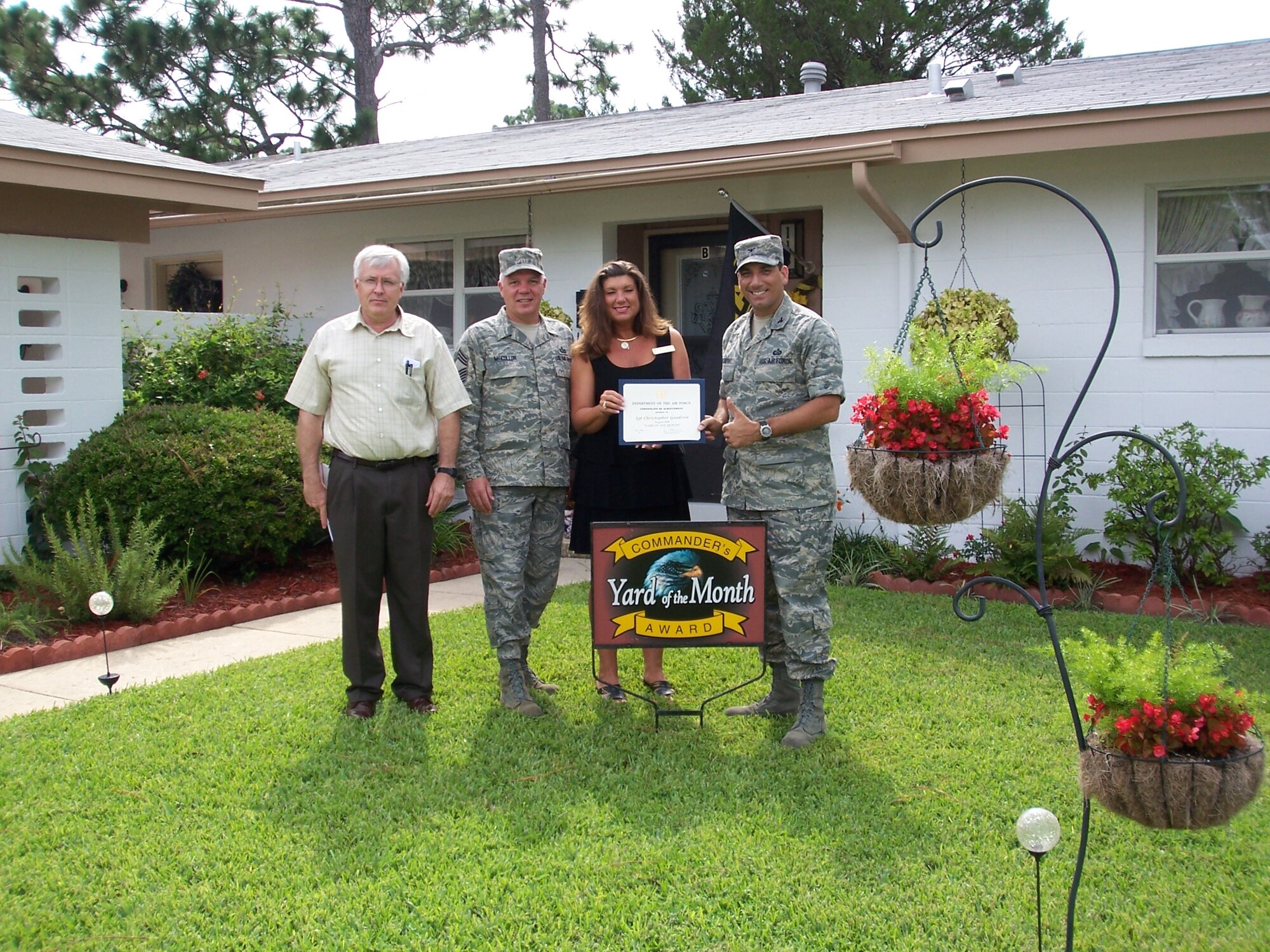 (Far right) Col. Rick LoCastro, 96th Air Base Wing vice commander, and other Team Eglin leadership recognized Tech. Sgt. Eric Yingling, 728th Air Control Squadron, and his wife, Marjorie, for the August Yard of the Month event. (Courtesy photo)