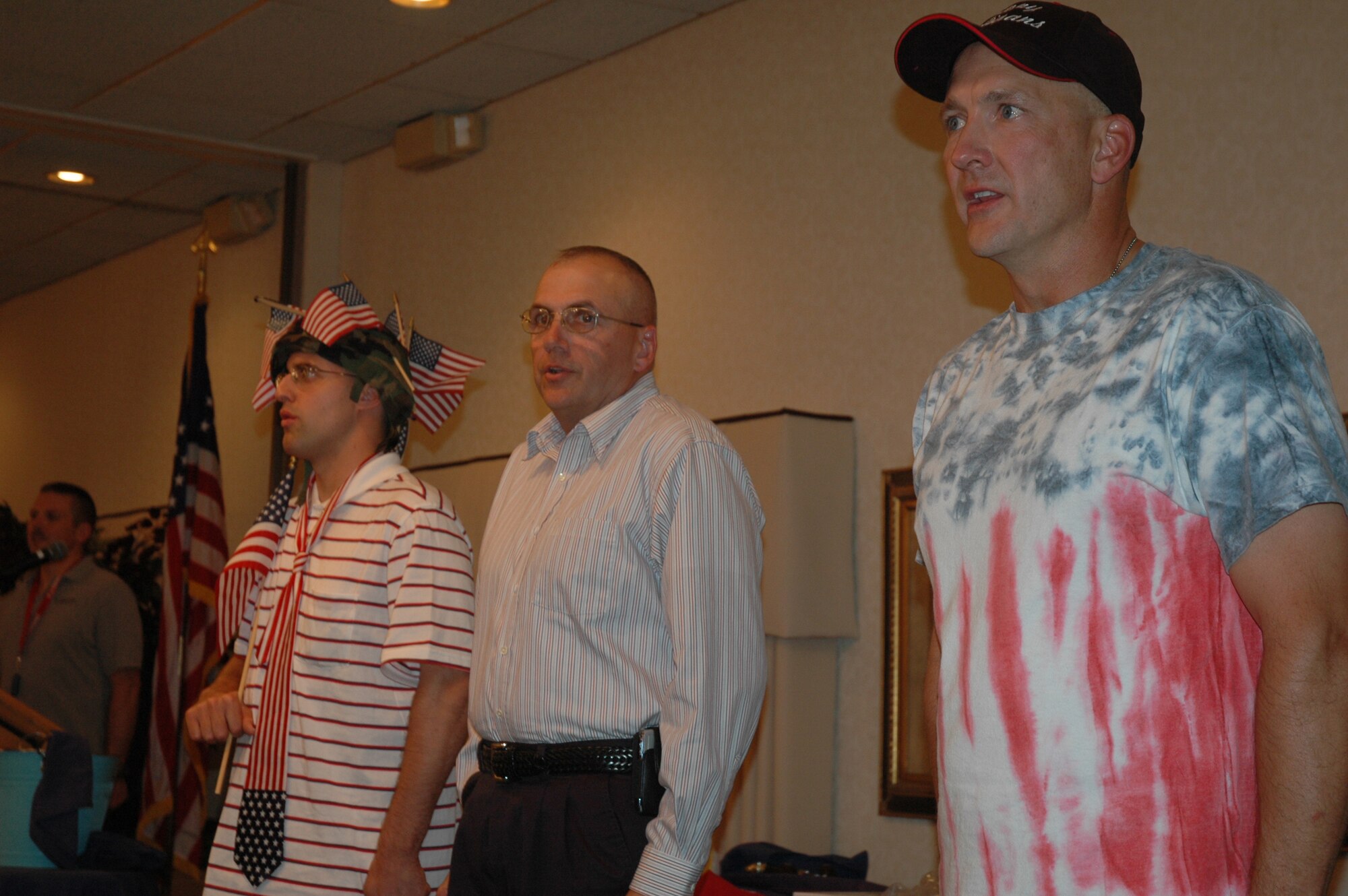 MINOT AIR FORCE BASE, N.D. – Chief Master Sgt. Mark Brejcha (far right), 91st Missile Wing command chief master sergeant, recites the Airman’s Creed along with Chief Master Sgt. Mark Clark (second from right), 5th Bomb Wing command chief master sergeant, and others during a going away party in Chief Brejcha's honor Aug. 25 at the Jimmy Doolittle Center here. (U.S. Air Force photo by Airman 1st Class Wesley Wright)