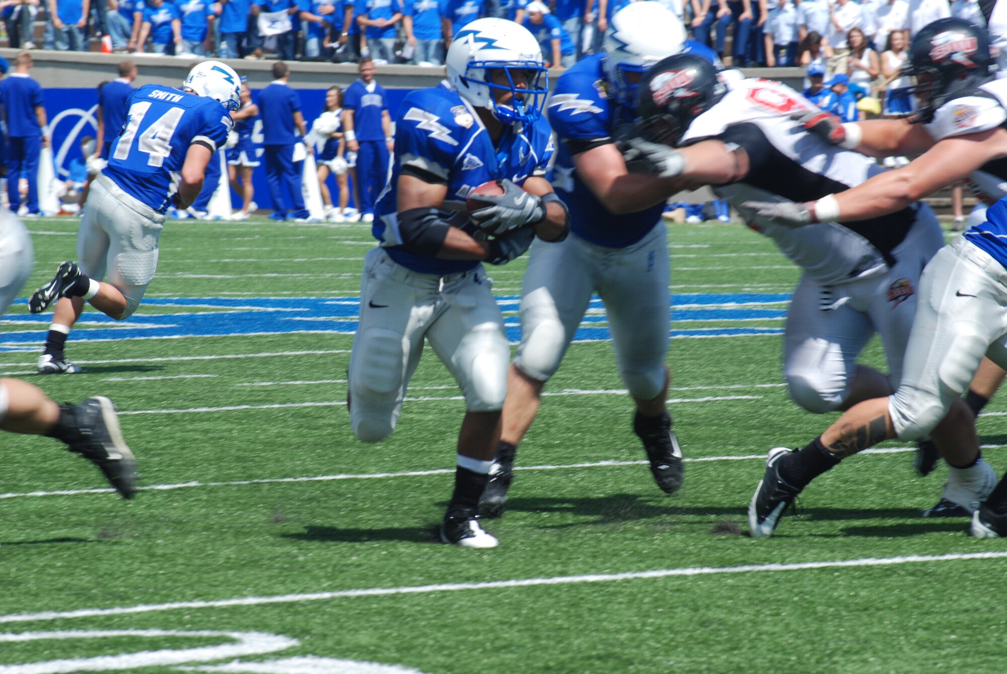 Air Force tailback Kyle Lumpkin runs up the middle during a 41-7 rout of Southern Utah University. Lumpkin had 19 attempts for 77 yards as the Falcons ran for 433 total yards. (U.S. Air Force photo/Denise Navoy) 
