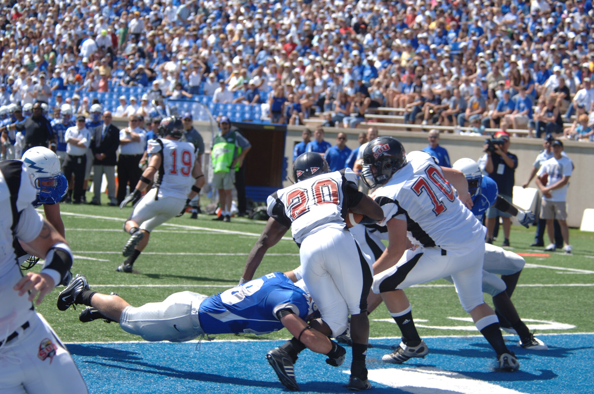 Inside linebacker Brandon Reeves lays out to tackle Southern Utah University running-back Kenny Apilli in the end zone for a safety and the first score of the day. Air Force recorded a school-record two safeties in the game, defeating the Thunderbirds, 41-7. (U.S. Air Force photo/John Van Winkle)
