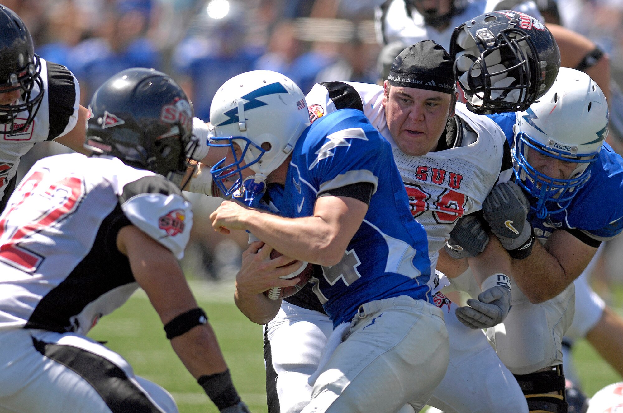 Quarterback Shea Smith battles for extra yards against Southern Utah University. Air Force dominated the game, winning 41-7. (U.S. Air Force photo/Mike Kaplan) 
