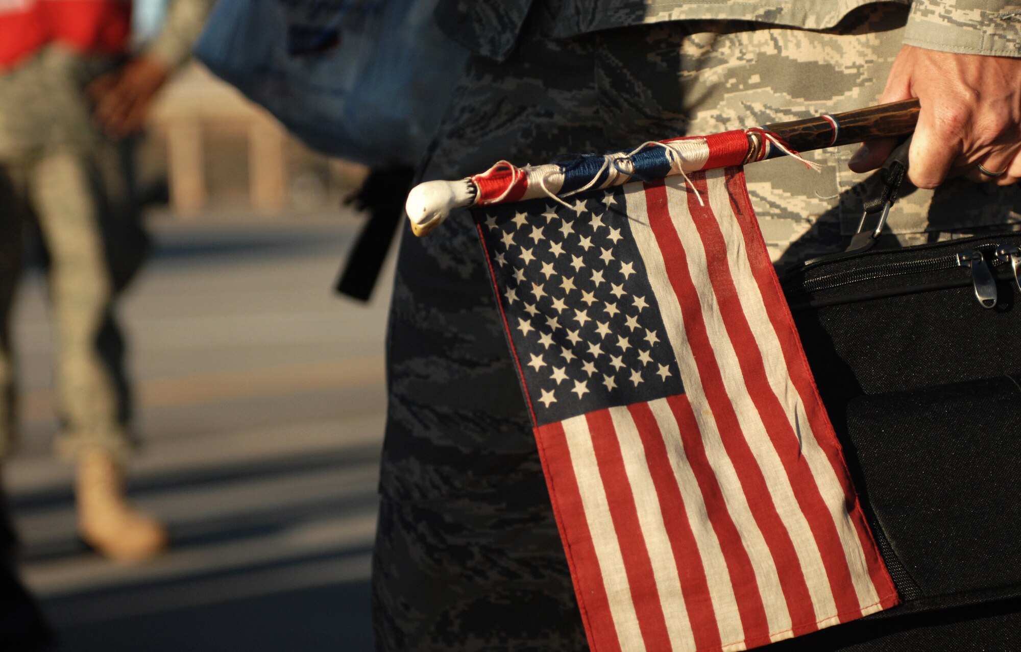 MOUNTAIN HOME AIR FORCE BASE, Idaho - Tech. Sgt. Anthony Mathews, 366th Aircrew Maintenance Squadron, carries an American flag on a deployment to southwest Asia. The 391st Fighter Squadron is deploying to Southwest Asia for a four month deployment. (U.S. Air Force photo/ Airman 1st Class Stephany Miller)