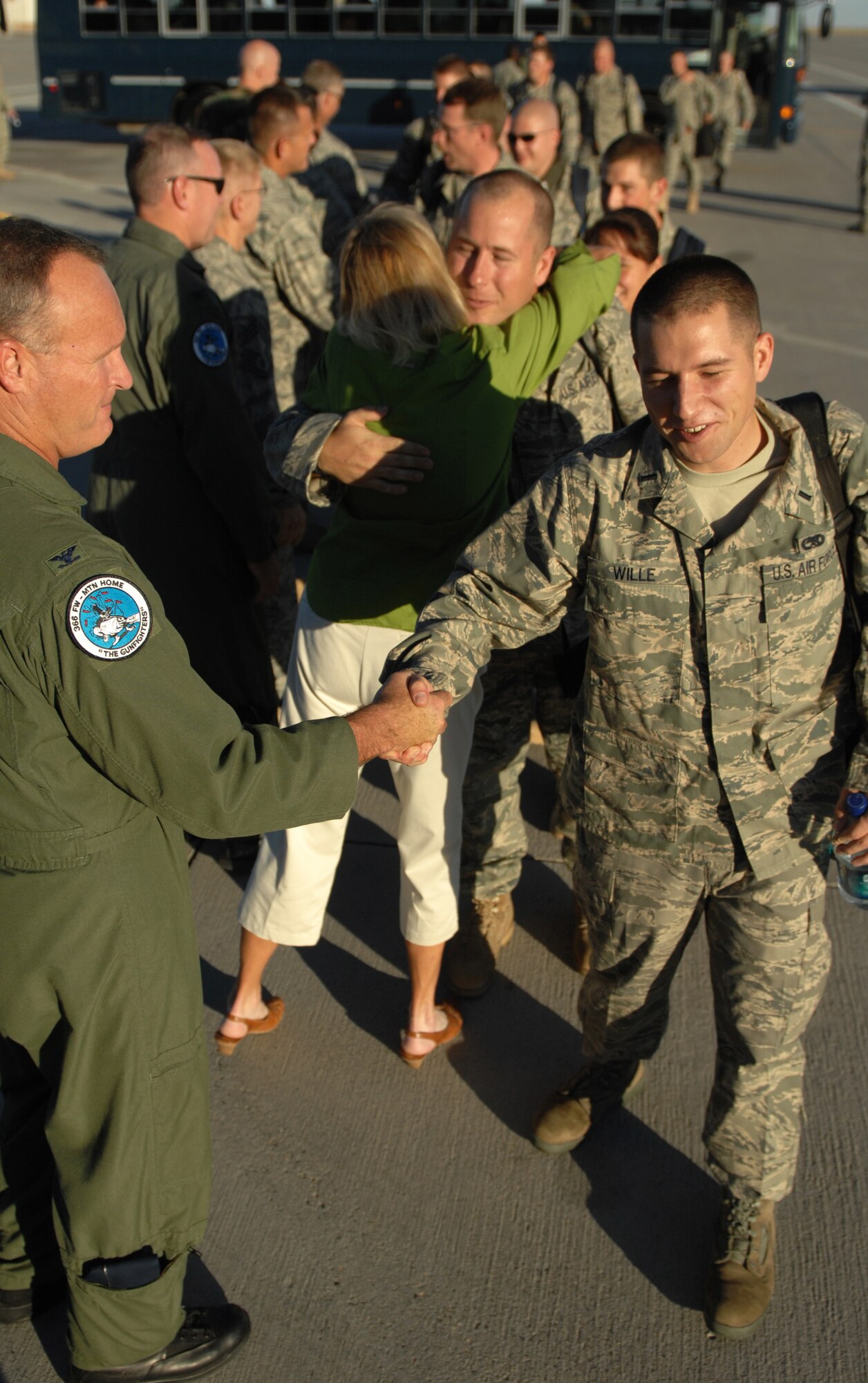 MOUNTAIN HOME AIR FORCE BASE, Idaho - Col. James Browne, 366th Fighter Wing commander, shakes hands and bids farewell to the departing Airmen. Approximately 400 Airmen from the 366th Fighter Wing deployed from the base in support of operations in Southwest Asia (U.S. Air Force photo/ Airmen 1st Class Stephany Miller)