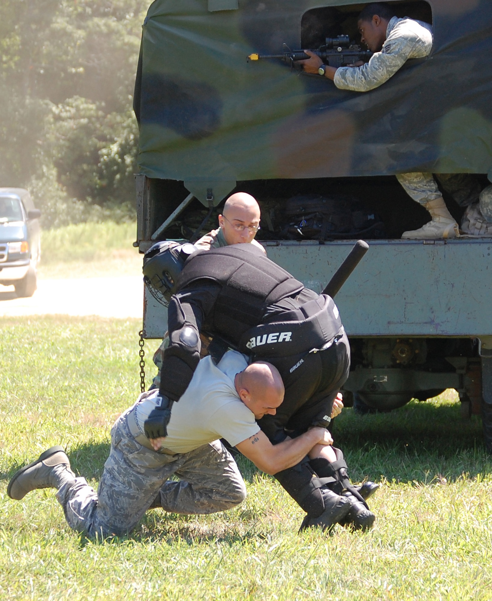 Students in the Air Force Phoenix Raven Training Course fight back an "attacker" during an evaluation session in the course on a Fort Dix, N.J., range Aug. 20, 2008.  The course, taught by the U.S. Air Force Expeditionary Center's 421st Combat Training Squadron, trains security forces Airmen to become Ravens where they specialize in protecting Air Force aircraft in austere environments.  (U.S. Air Force Photo/Tech. Sgt. Scott Mueller)