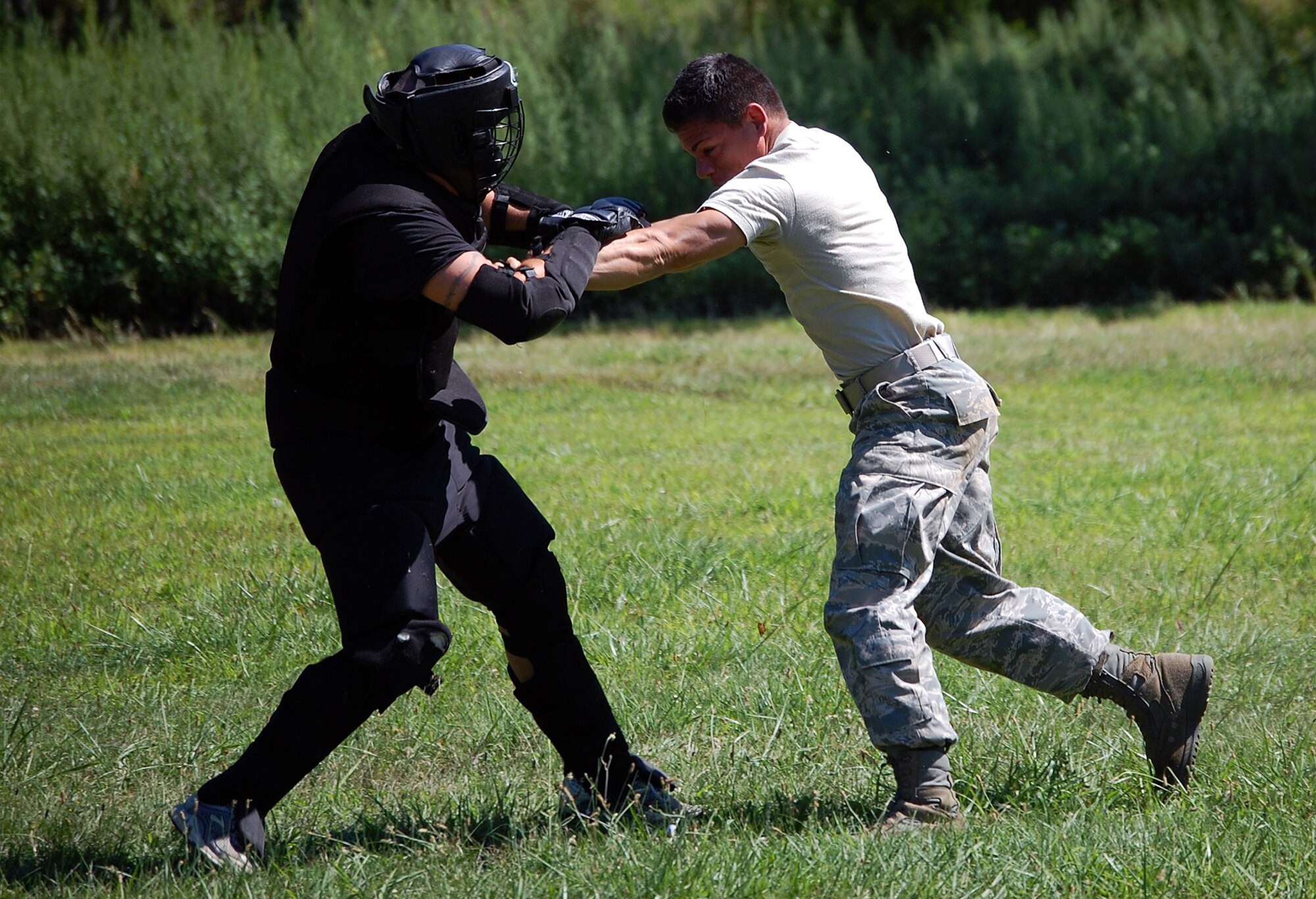A student in the Air Force Phoenix Raven Training Course, fights back an "attacker" during an evaluation session in the course on a Fort Dix, N.J., range Aug. 20, 2008.  The course, taught by the U.S. Air Force Expeditionary Center's 421st Combat Training Squadron, trains security forces Airmen to become Ravens where they specialize in protecting Air Force aircraft in austere environments.  (U.S. Air Force Photo/Tech. Sgt. Scott Mueller)