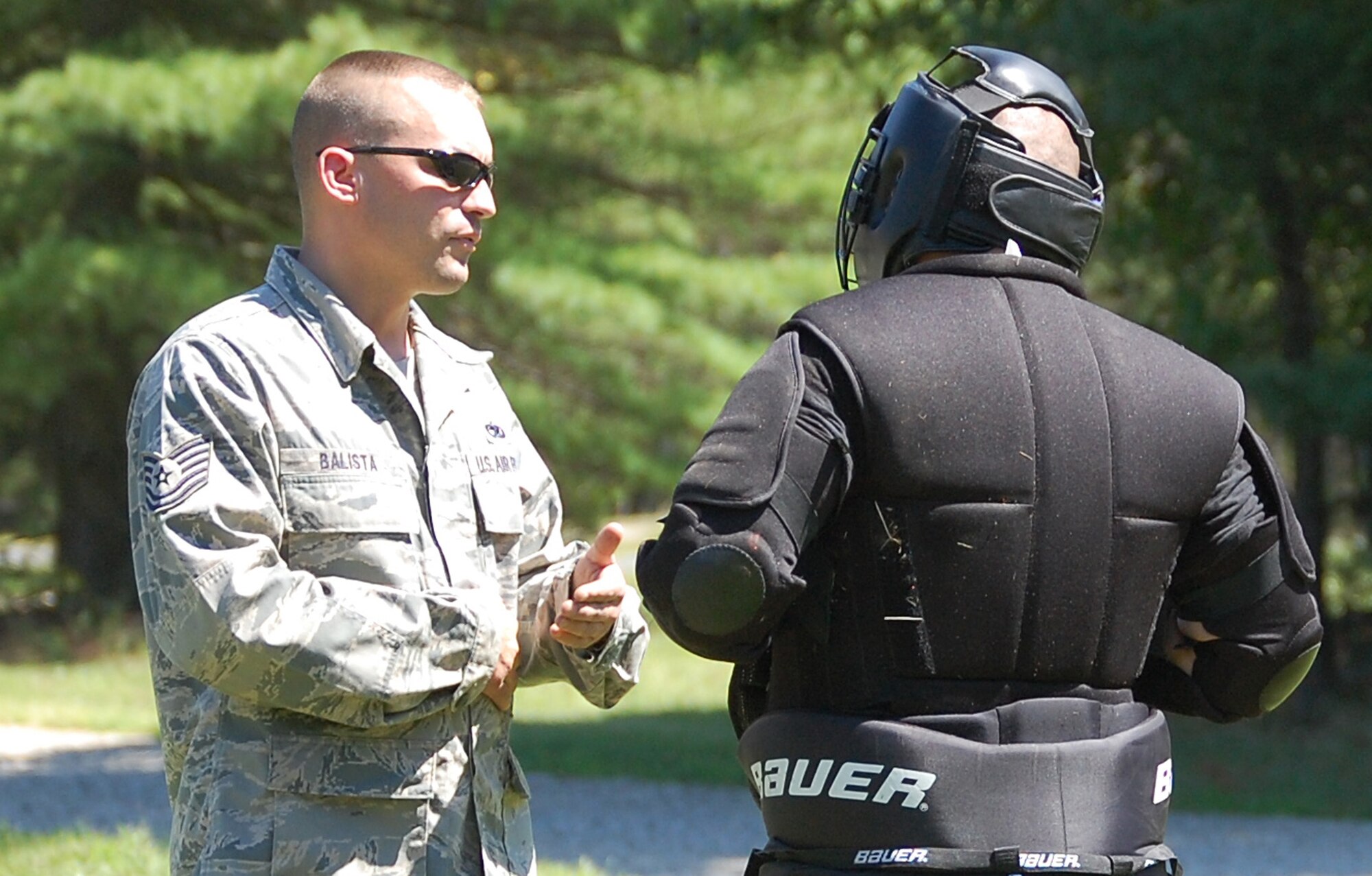 Tech. Sgt. David Balista, a student in the Air Force Phoenix Raven Training Course 08-D and also an instructor from the U.S. Air Force Expeditionary Center's 421st Combat Training Squadron, uses "verbal judo" to deescalate the temperament of an "agressor" during an evaluation session for the Raven course on a Fort Dix, N.J., range Aug. 20, 2008.  The Raven course, taught by the 421st CTS, provides specialized training to security forces Airmen in areas such as aircraft security, self defense and verbal communications.  Upon graduation, the students receive their Raven number and are certified to fly and protect Air Force aircraft at austere airfields around the world.  Sergeant Balista, an aerospace ground equipment craftsman, took the course as part of cadre training and career broadening.  (U.S. Air Force Photo/Tech. Sgt. Scott Mueller)