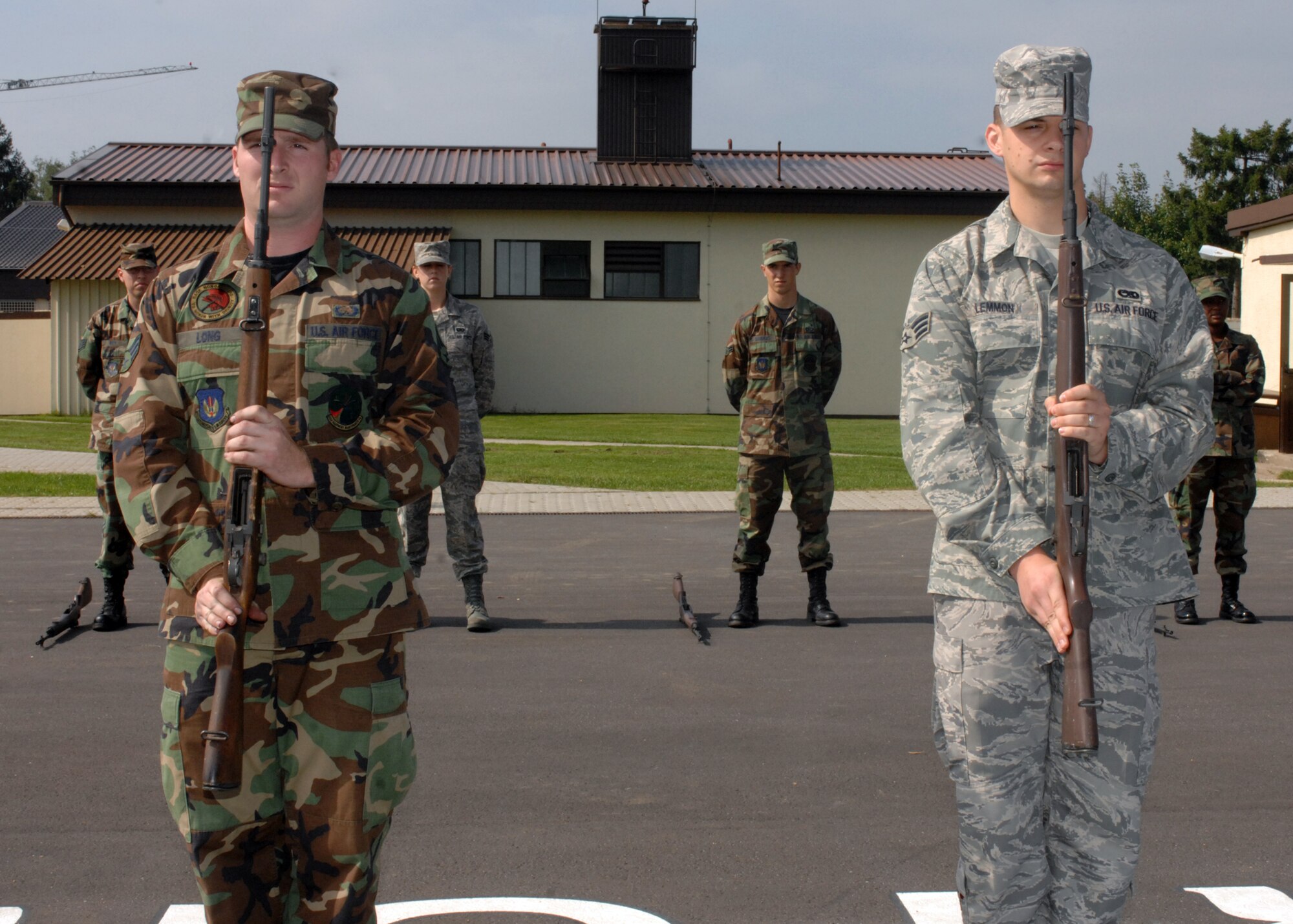SPANGDAHLEM AIR BASE, Germany – Staff Sgt. Hector Quinones-Santiago and Staff Sgt. Brad Johnson listen as Staff Sgt. Lee Haynor explains the proper maneuver for handling a rifle during ceremonies at the 52nd Fighter Wing Base Honor Guard practice August 27, 2008. (U.S. Air Force photo by Airman 1st Class Jenifer H. Calhoun)