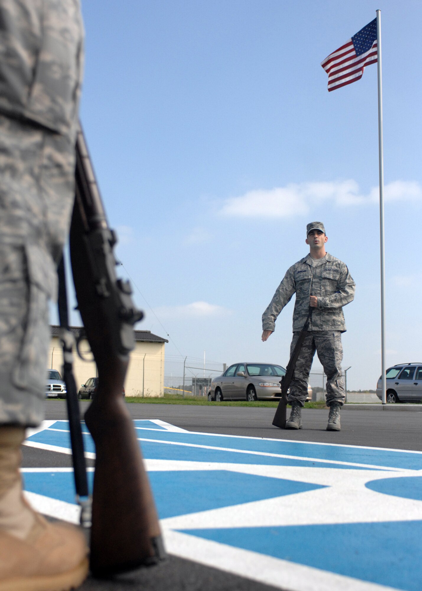 SPANGDAHLEM AIR BASE, Germany – Staff Sgt. Christopher Johnson, 52nd Fighter Wing Base Honor Guard Team Alpha Trainer, demonstrates the proper way to conduct a drill maneuver during practice August 27, 2008. (U.S. Air Force photo by Airman 1st Class Jenifer H. Calhoun)