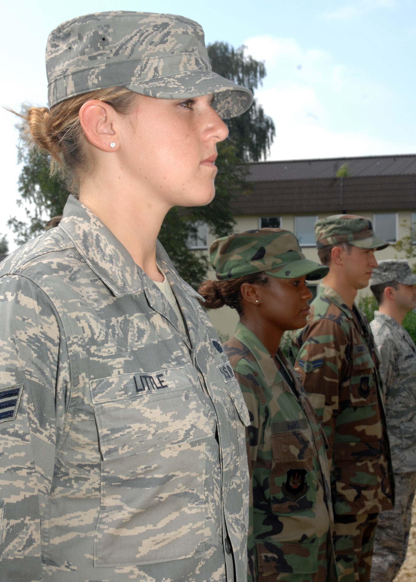 SPANGDAHLEM AIR BASE, Germany – (Left to right) Senior Airman Katherine Little, Senior Airman Tashanna Harris, Airman 1st Class Andrew Sanders, and Staff Sgt. Christopher Johnson, 52nd Fighter Wing Base Honor Guard members, stand at the position of attention August 27, 2008. (U.S. Air Force photo by Airman 1st Class Jenifer H. Calhoun)