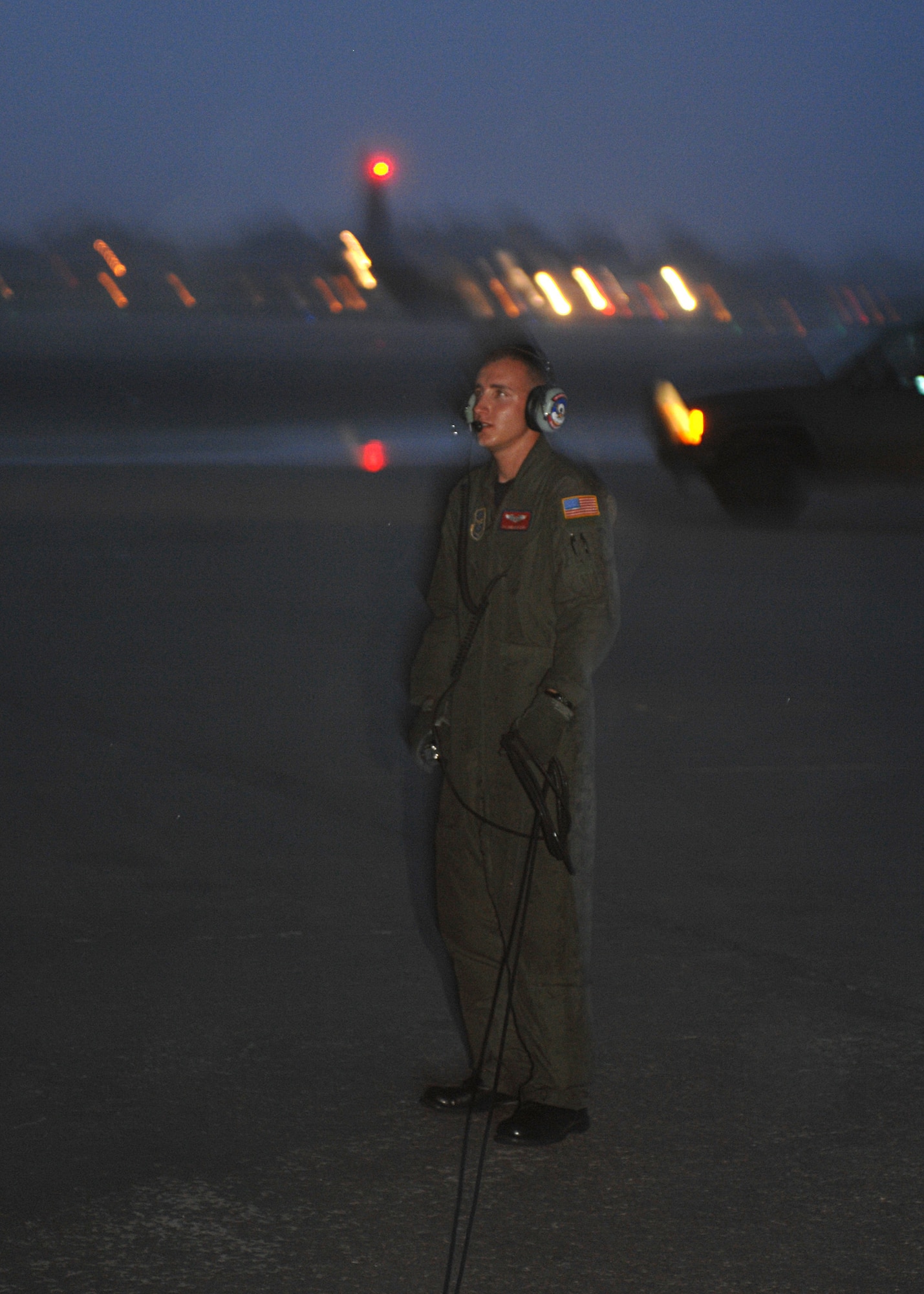 NEW ORLEANS INTERNATIONAL AIRPORT-- Senior Airman Sheldon Cary, a 39th Airlift Squadron loadmaster from Dyess Air Force Base, Texas, waits for an engine check as Hurricane Gustav pounds New Orleans with the first rainfall, August 31. Four C-130s and aircrews from Dyess evacuated more than 400 local residents and critically ill patients from local hospitals. The evacuees were sent to different cities in Tennessee where relief teams were awaiting their arrival with food, water and shelter. (U.S. Air Force photo/ Senior Airman Jennifer Romig)
