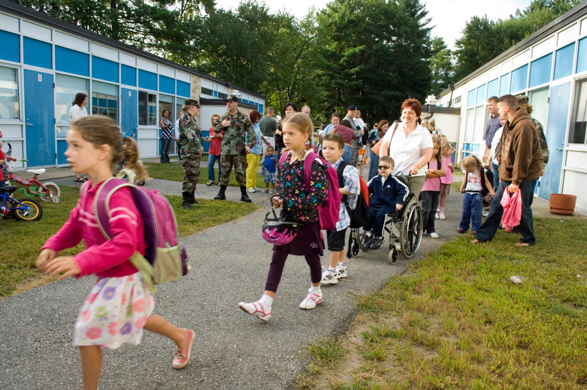 HANSCOM AFB, Mass. -- Students, faculty members and parents gather outside the Hanscom Primary and Middle Schools Sept. 2 before classes for the 2008-2009 school year begin. The year's theme at the primary school is 'Math Matters!,' while the theme for the middle school is Hanscom CARES, which stands for Cooperation, Assertion, Responsibility, Empathy and Self-control. (U.S. Air Force photo by Rick Berry)