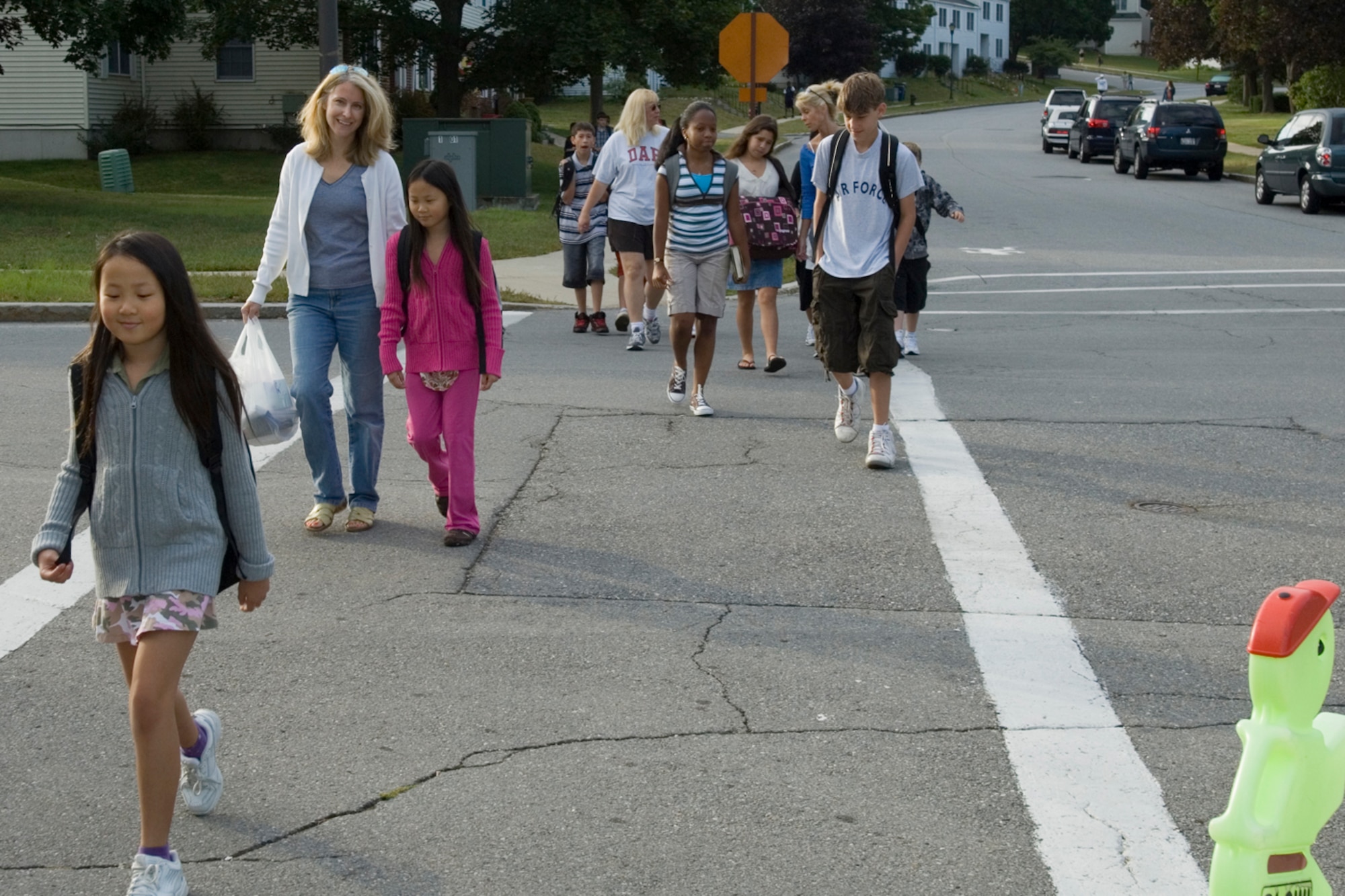 HANSCOM AFB, Mass. -- Parents and students walk to Hanscom Primary and Middle Schools for the first day of classes of the 2008-2009 school year Sept. 2. Both schools will focus heavily on helping students to hone their mathematics skills by studying the significance of math in a variety of practical applications, such as the upcoming elections.  Parents who are interested in learning the latest information about either school should visit the Lincoln Public School Web site, www.lincnet.org. (U.S. Air Force photo by Rick Berry)