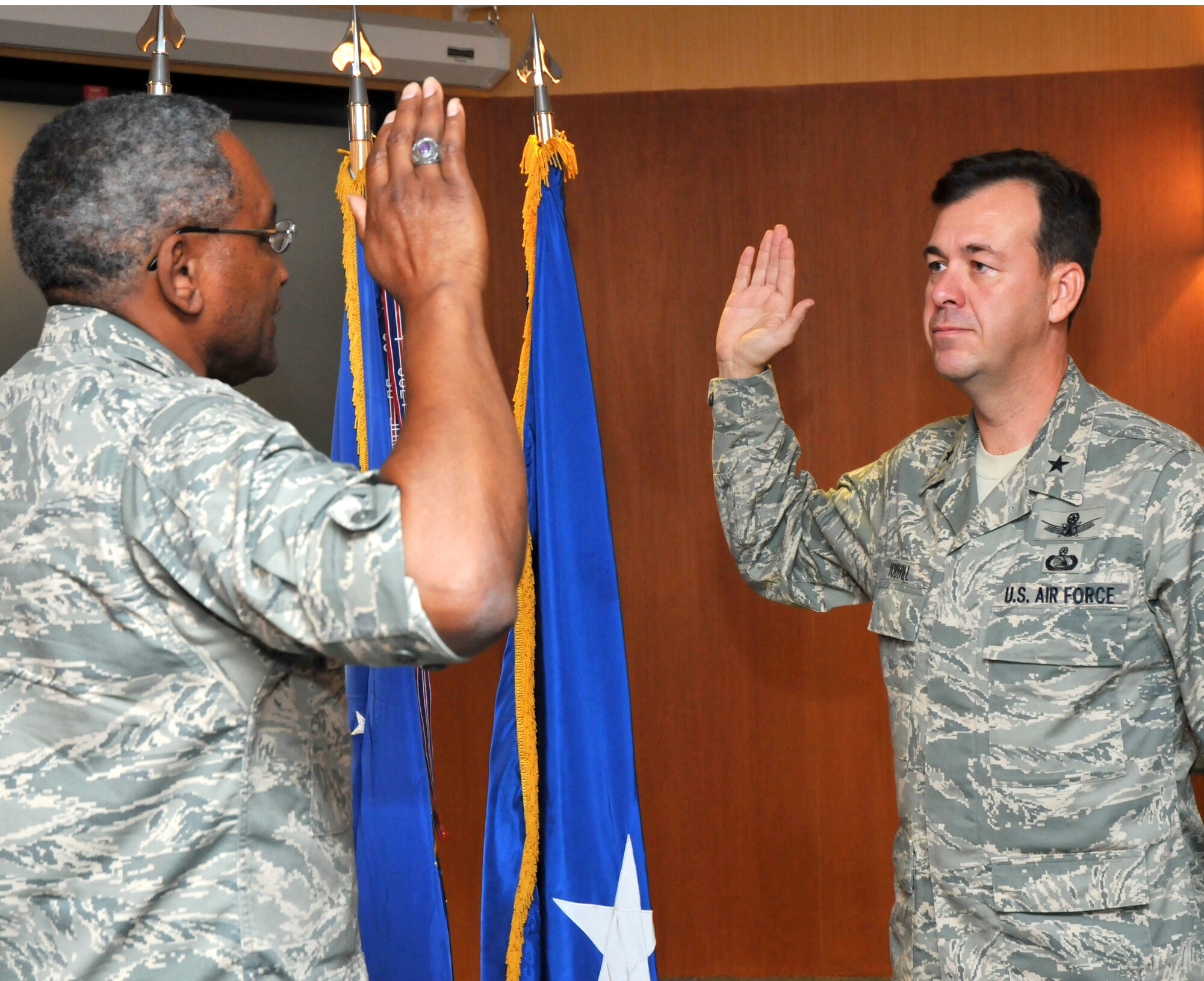 Maj. Gen. Alfred Flowers, 2nd Air Force commander, administers the oath of office promoting Brig. Gen. Greg Touhill, 81st Training Wing commander, to his new rank.  The ceremony took place September 2, in Keesler's Hurricane Gustav command center. (U.S. Air Force photo by Adam Bond).