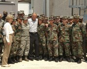 9/1/2008 - President George W. Bush poses with Lackland Airmen who volunteered to help process more than 700 evacuees of Hurricane Gustav at Kelly Field Annex Sept 1. (USAF photo by Alan Boedeker)                                
