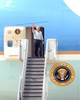 9/1/2008 - President George W. Bush waves as he exits Air Force One Sept. 1 at Lackland Air Force Base, Texas. The president visited San Antonio to be briefed on evacuation processes in response to Hurricane Gustav and to also personally thank Airmen responsible for the successful relief efforts. (USAF photo by Alan Boedeker)