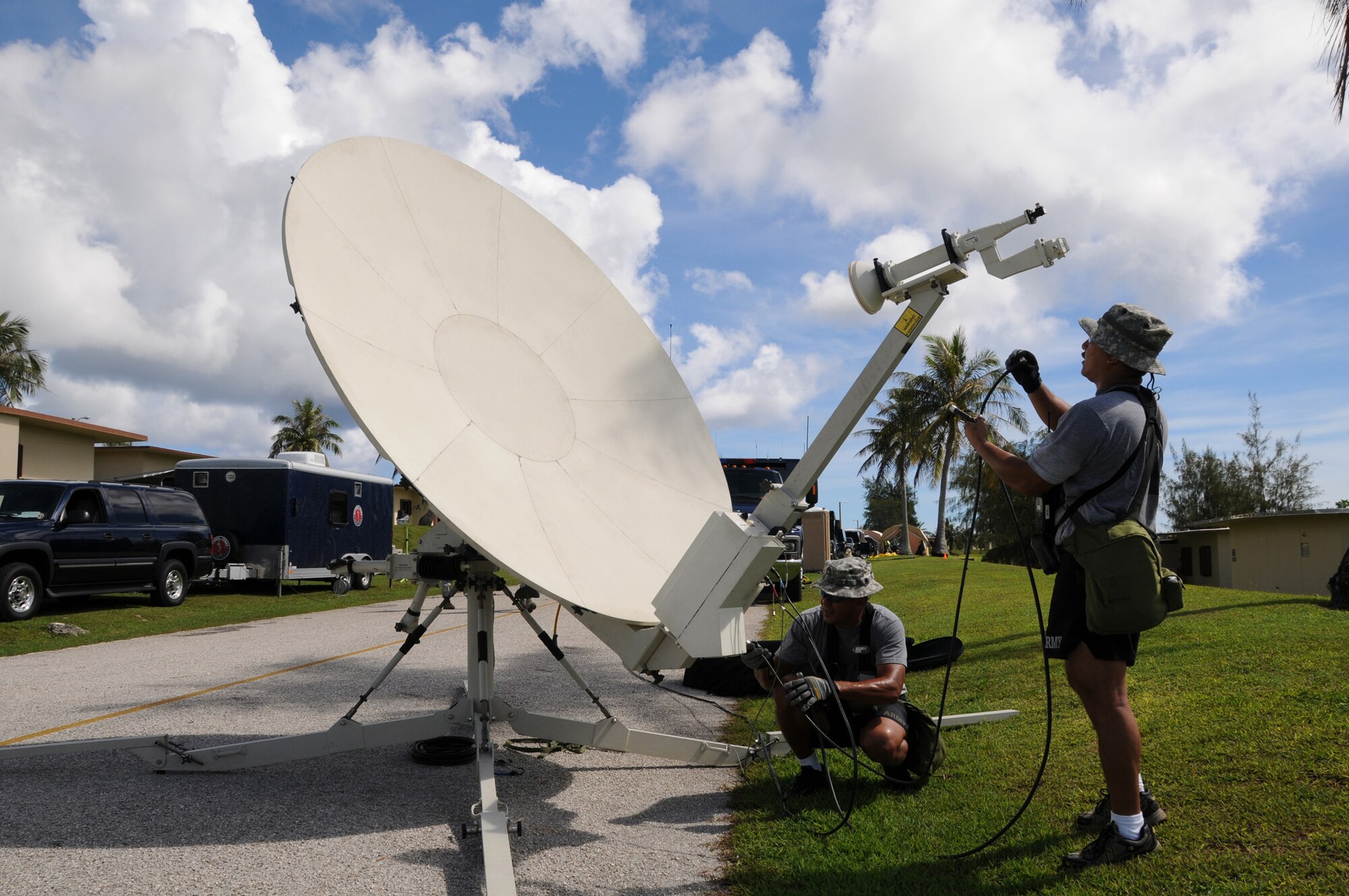 ANDERSEN AIR FORCE BASE, Guam - Members of Guam's National Guard Civil Support Team set up a unified command site during their certification here August 25. The UCS provides internet and reach back capabilities for the team. (U.S. Air Force photo by Staff Sgt. Jamie Lessard)
