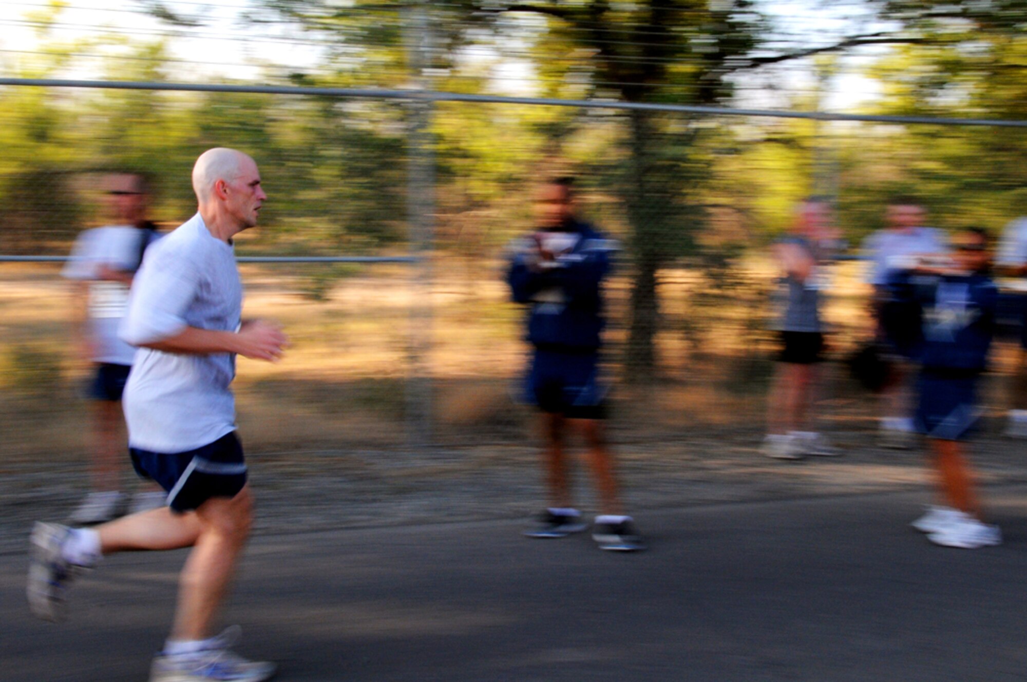 MANAS AIR BASE, KYRGYZ REPUBLIC -- Maj. Anthony Bell, 376th Air Expeditionary Wing Judge Advocate, pushes out his final steps of the Manas AB half marathon, Aug. 31. Over 100 members of the Manas AB team participated in the early morning 13.1 mile race, which gave participants an opportunity to physically and mentally challenge themselves. (Air Force photo / Airman 1st Class Ruth Holcomb) 

 
 
 
 
 