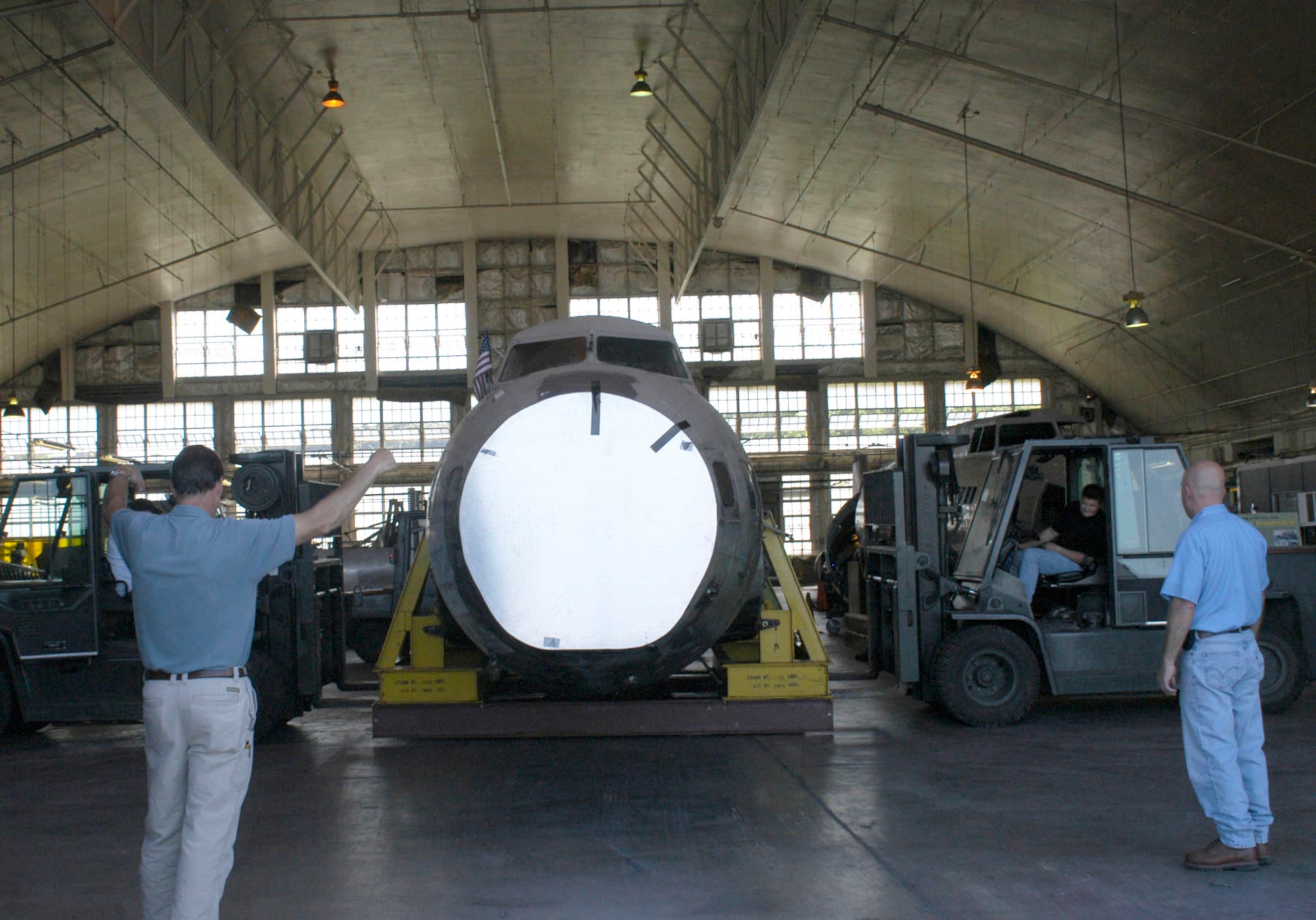 DAYTON, Ohio -- Restoration crews work together to unload the fuselage of the B-17D "The Swoose" that recently arrived at the National Museum of the U.S. Air Force from the National Air and Space Museum. (U.S. Air Force photo)