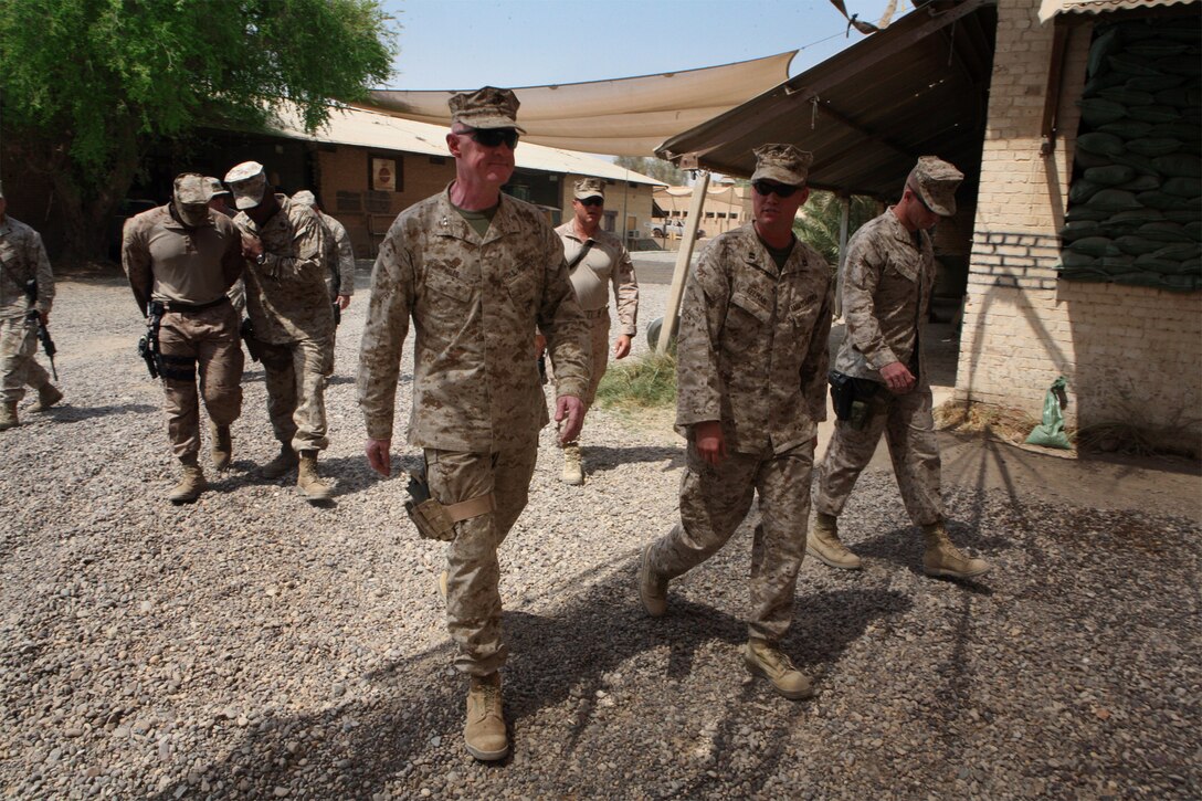 CAMP HABBANIYAH, Iraq (August 3, 2008) – Maj. Gen. Richard P. Mills (center), Ground Combat Element Commander, Multi National Force – West, walks with Task Force 1st Battalion, 2nd Marine Regiment, Regimental Combat Team 1, staff during his visit Sept. 3. Mills met with the battalion’s command and staff, to discuss progress and the transition of authority to Iraqi-led operations. (Official U.S. Marine Corps photo by Lance Cpl. Scott Schmidt)