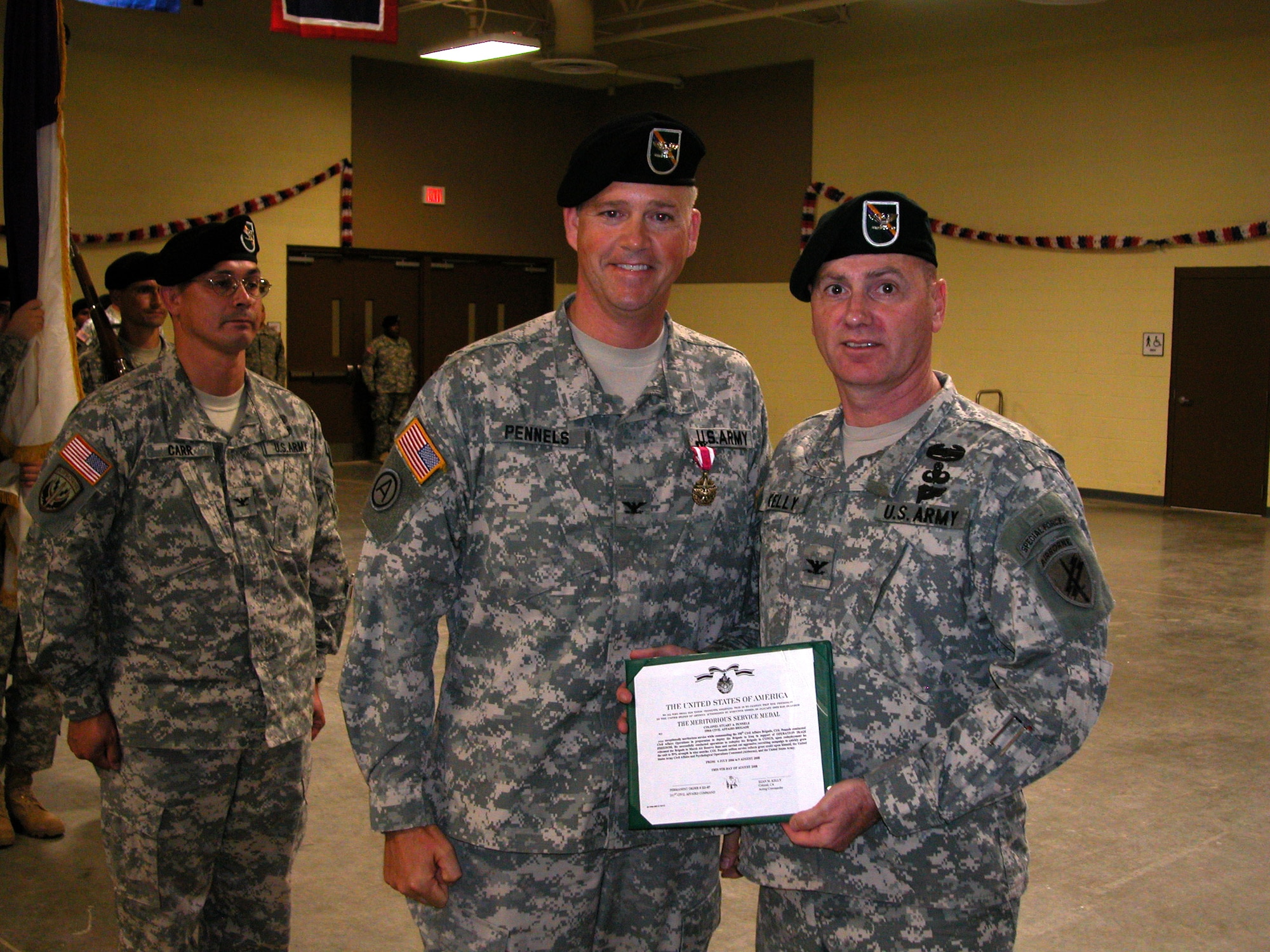 Col. Stuart “Toby” Pennels (left) is awarded the Meritorious Service Medal from Col. Sean M. Kelly (pictured)

Colonel Robert E. Crowley assumes command of the 358th Civil Affairs Brigade from Col. Stuart “Toby” Pennels during a change of command ceremony on Aug. 9 at March Air Reserve Base presided over by Col. Sean M. Kelly, deputy commander and chief of staff, 351st Civil Affairs Command. Civil Affairs is the capability the U.S. Army employs to enhance cooperation between the military and the civilian population of a foreign country. Its forces provide cultural expertise and the unique ability to work together with the civilian population of a war zone or disaster relief area. The 358th Civil Affairs Brigade is part of the U.S. Army Civil Affairs and Psychological Operations Command which is headquartered at Fort Bragg, N.C. They are one of the major contributors in the rebuilding efforts in Iraq and Afghanistan, providing humanitarian aid and restoring basic service. The Brigade recently moved from Norristown, PA, to March ARB. (U.S. Air Force photos by Maj. Don Traud, 452 AMW/PA)