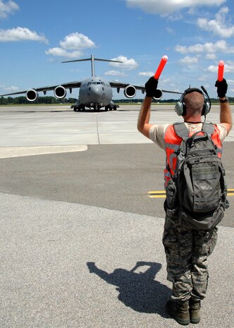 An Airman from the 315th Aircraft Maintenance Squadron taxis the last remaining C-17 to the runway for it's evacuation on the base flightline Sept. 4. The base evacuated aircraft in preparation for possible hurricane conditions. (U.S. Air Force photo/Airman 1st Class Timothy Taylor)