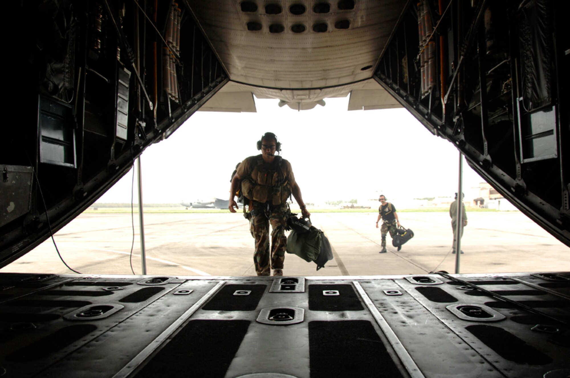 Tech. Sgt. Luigge Romanillo, 129th Rescue Wing pararescueman, embarks on an MC-130P Combat Shadow in Meridian, Miss., Sept. 3. Sergeant Romanillo was on search and rescue alert in Mississippi and returned to Ellington Field, Texas. More than 80 Airmen from the 129th RQW deployed to Ellington Field, Texas, as part of Joint Task Force 129, which supported Hurricane Gustav rescue operations. Air National Guardsmen from the 106th Rescue Wing, Gabreski Airport, N.Y., and 176th Wing, Kulis Air National Guard Base, Alaska, were also part of the rescue task force. (U.S. Air Force photo by Tech. Sgt. Ray Aquino)