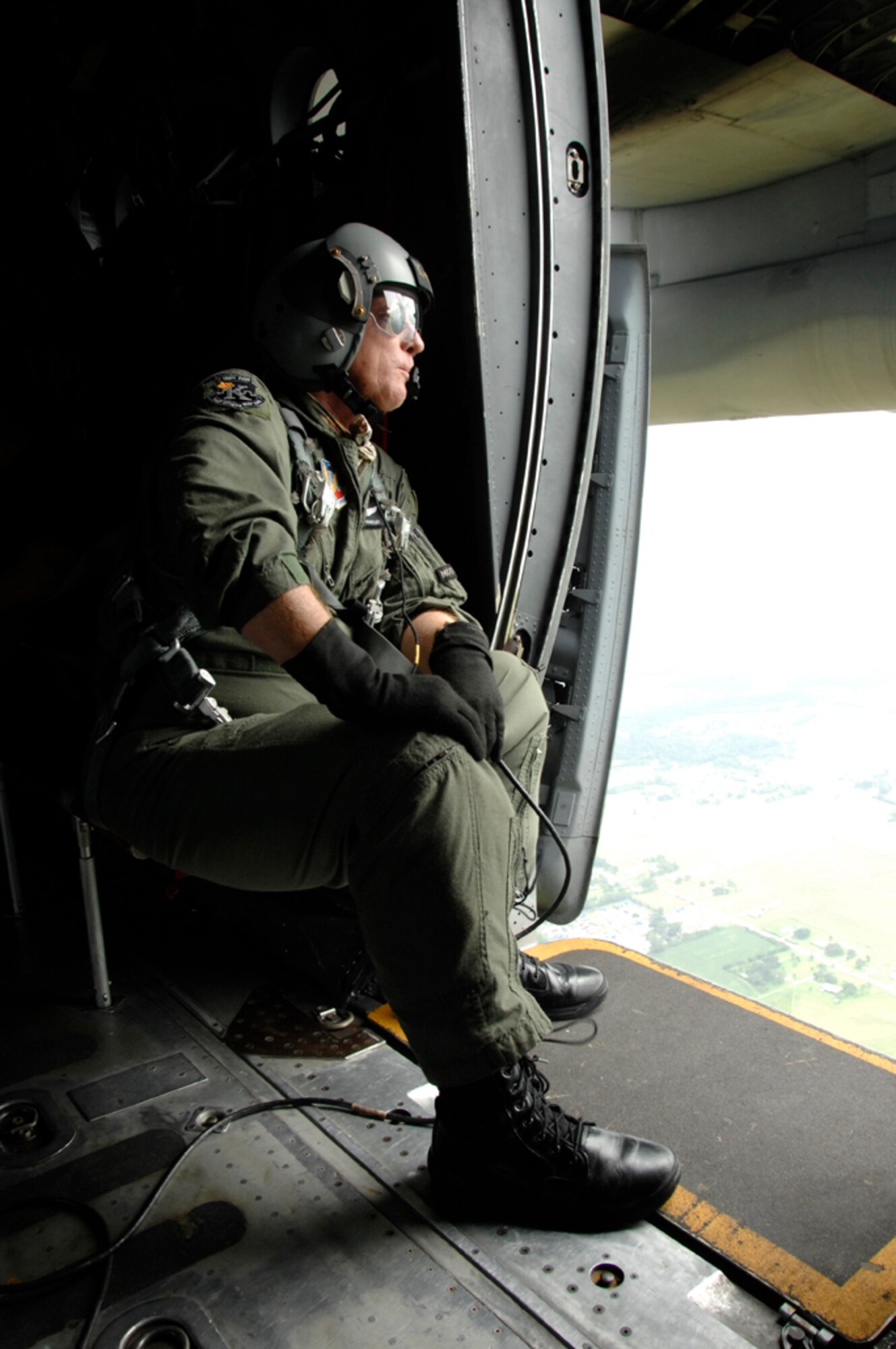 Chief Master Sgt. Ken Huntley, 129th Rescue Wing loadmaster, waits for the HH-60G Pave Hawk to link up with the MC-130P Combat Shadow during an aerial refueling over Louisiana.  More than 80 Airmen from the 129th RQW deployed to Ellington Field, Texas, as part of Joint Task Force 129, which supported Hurricane Gustav rescue operations. Air National Guardsmen from the 106th Rescue Wing, Gabreski Airport, N.Y., and 176th Wing, Kulis Air National Guard Base, Alaska, were also part of the rescue task force. (U.S. Air Force photo by Tech. Sgt. Ray Aquino)