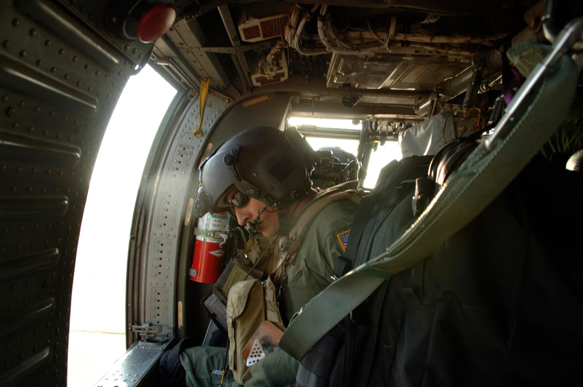 Staff Sgt. Andy Pena performs in-flight calibrations on a HH-60 Pave Hawk while flying Sept. 3 over Ellington Field, Texas. He and members of the 55th Rescue Squadron deployed from Davis-Mothan Air Force Base, Ariz., to Ellington Field in response to Hurricane Gustav with less than 24 hours after notification. Sergeant Pena is an aerial gunner. (U.S. Air Force photo/Master Sgt. Ben Gonzales) 
