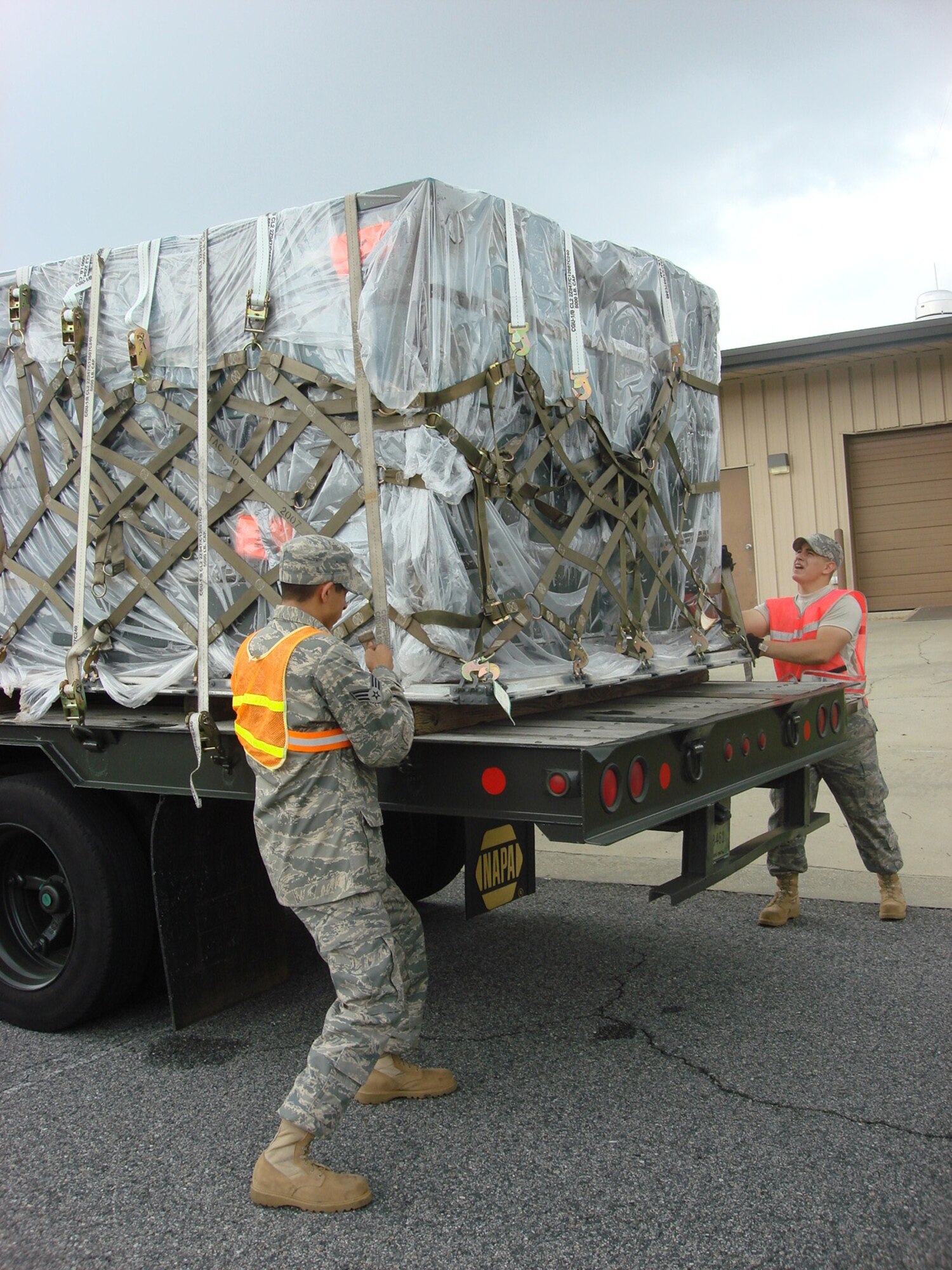 Senior Airman Rodrigo Soza (left) and Airman 1st Class Camden Rodriguez, both of the 53rd Combat Communications Squadron, prepare a pallet of communications equipment to take to Mississippi for hurrican relief efforts. Courtesy Photo  