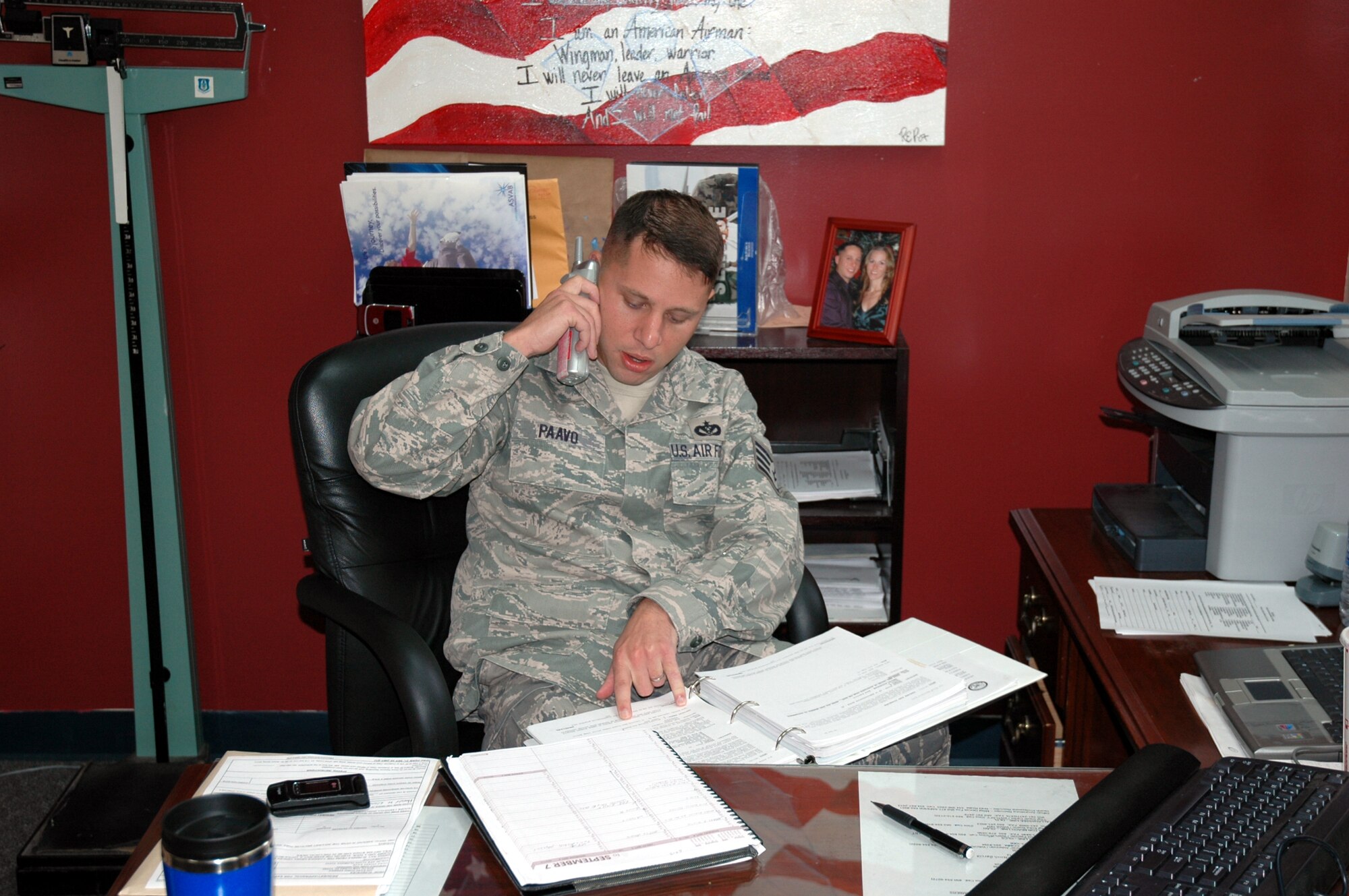 Staff Sgt. Brian Paavo, 919th Special Operations Wing recruiter, relays information on the Air Force Reserve to a prospective recruit using the "Get One" program. The program allows reservists to help recruit individuals into the Reserves by being recognized for recommending people to join the service. (U.S. Air Force Photo/Senior Airman Jon McCallum)