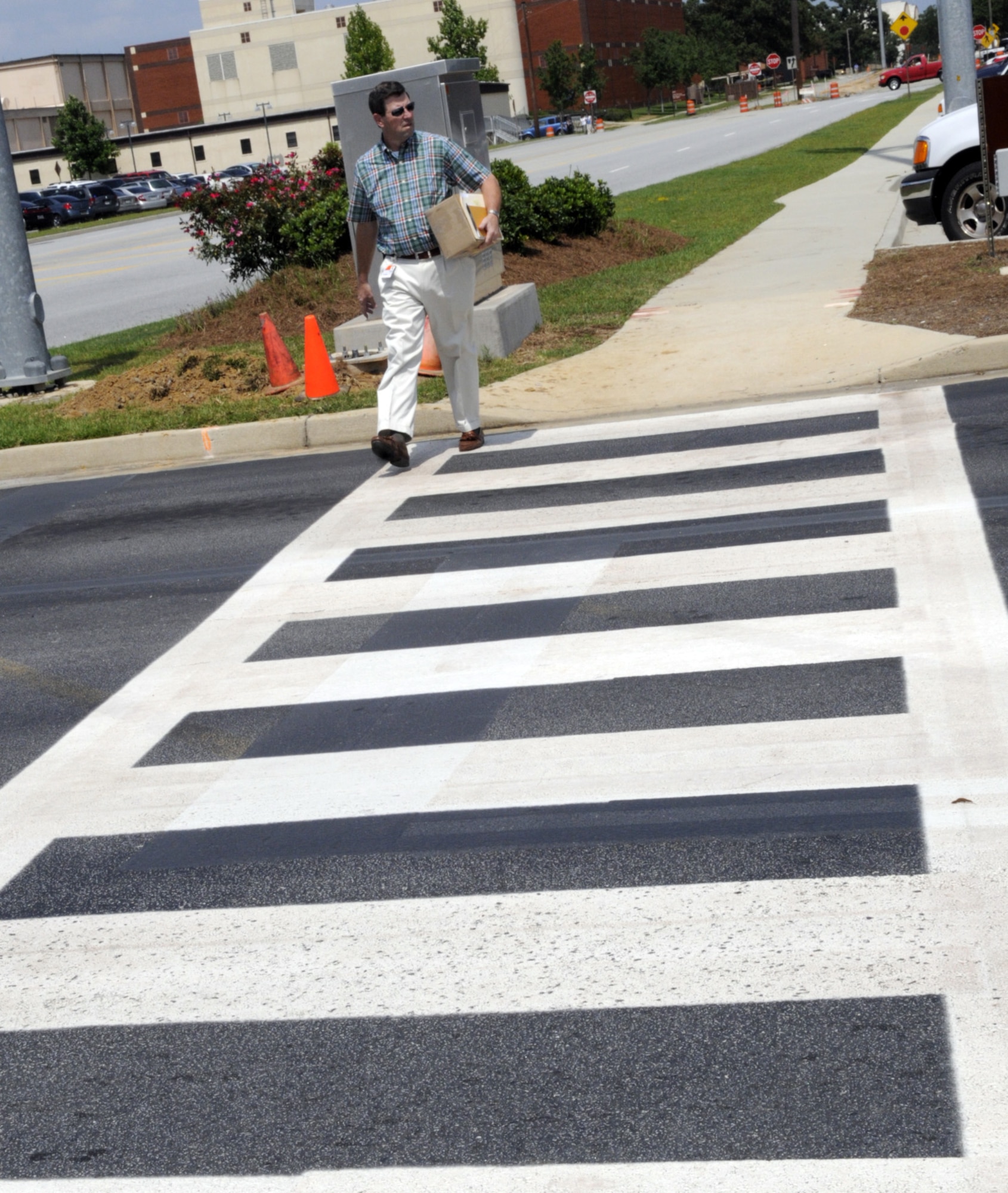 Pete O'Neill uses the new crosswalk at Watson Boulevard Annex and Byron Street. U. S. Air Force photo by Sue Sapp