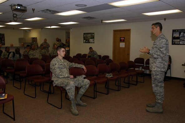MINOT AIR FORCE BASE, N.D. — Col. Steven Basham, 5th Bomb Wing vice commander, speaks to Airmen during the Installation Personnel Readiness Element pre-deployment briefing here Aug. 28.  Colonel Basham’s speech helped prepare the Airmen for what to expect on their upcoming deployments. (U.S. Air Force photo by Airman 1st Class Jesse Lopez)
