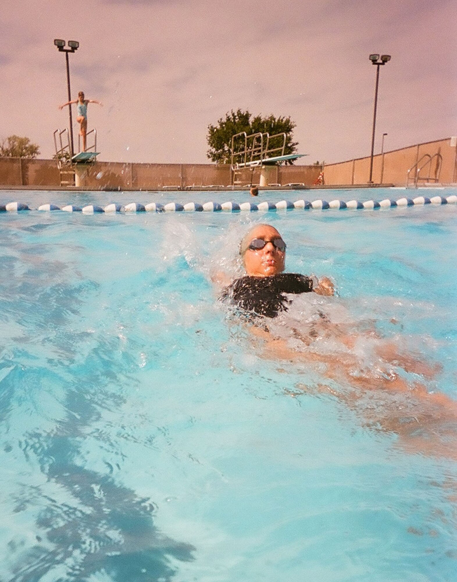 Abbey Allen, 15,  swims the backstroke at the base pool Aug. 25. She, along with Derek Lair and Earl Lara, competed in the Western Zone Swim Championship in Gresham, Ore., Aug. 5-9, where they were part of "Team Montana." The team is comprised of 42 swimmers from across the state and they finished sixth out of 16 teams from across the West Coast. Their parents work for the 341st Missile Wing and they are juniors in high school. (U.S. Air Force photo/Senior Airman Eydie Sakura)
