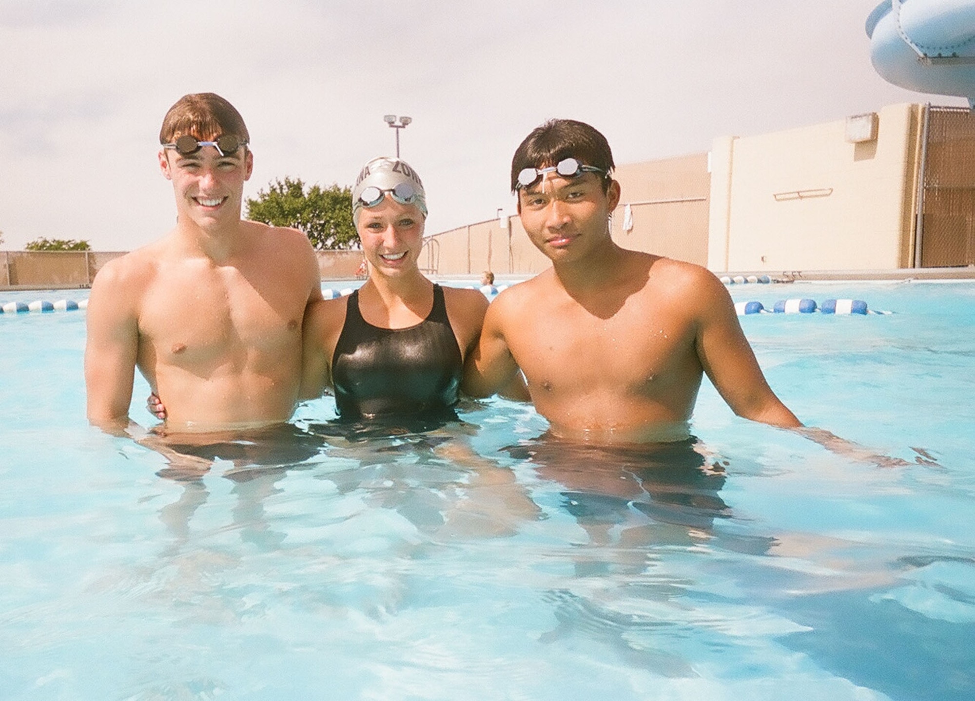 Derek Lair, 17, Abbey Allen, 15, and Earl Lara, 16, pose for a photo at the base pool Aug. 25. They competed in the Western Zone Swim Championship in Gresham, Ore., Aug. 5-9, where they were part of "Team Montana." The team is comprised of 42 swimmers from across the state and they finished sixth out of 16 teams from across the West Coast. Their parents work for the 341st Missile Wing and they are juniors in high school. (U.S. Air Force photo/Senior Airman Eydie Sakura)
