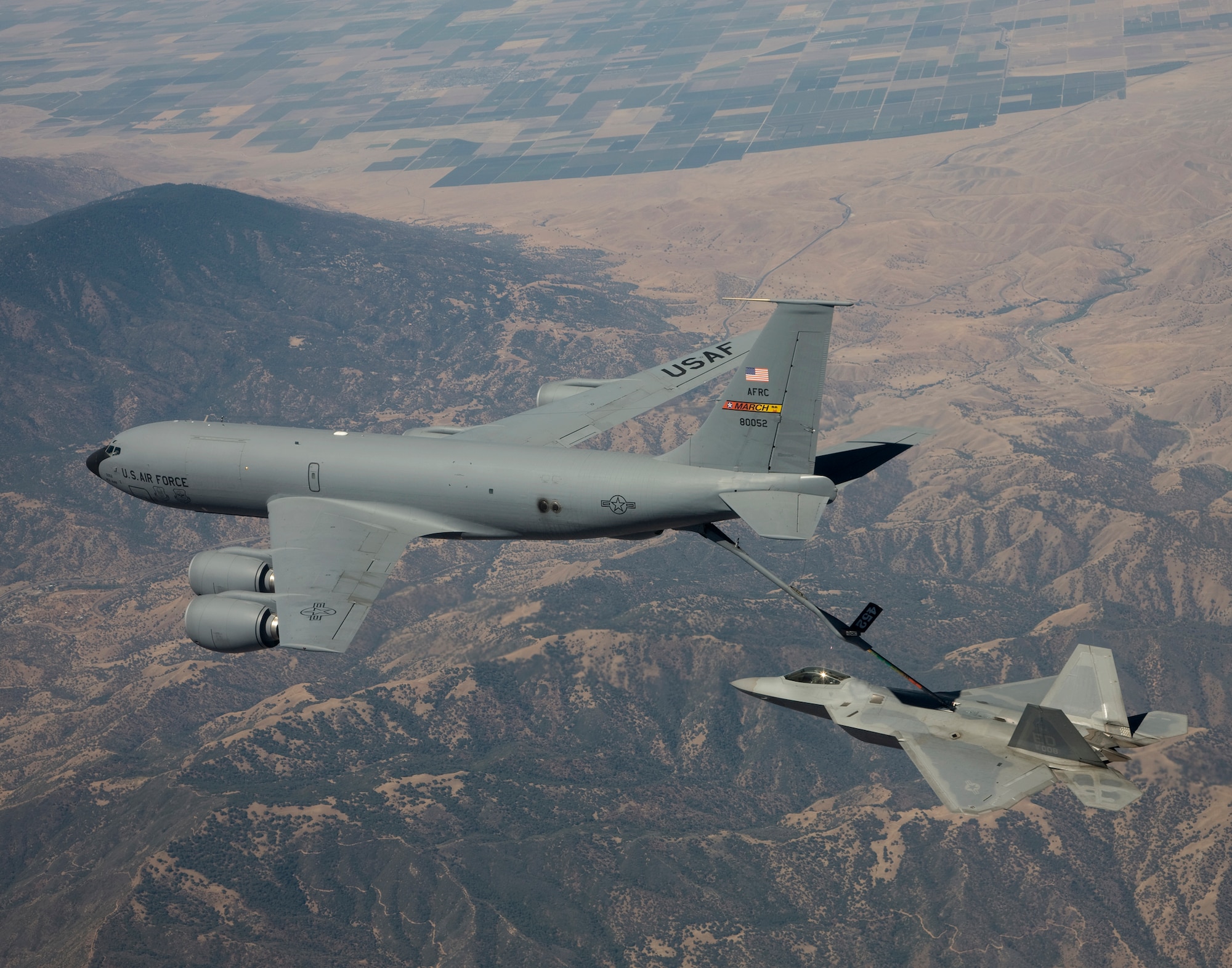 An F-22 Raptor from Edwards Air Force Base, Calif., receives synthetic fuel from a KC-135 Stratotanker Aug. 28 during an aerial refueling test using an alternative jet engine fuel.  The KC-135 Stratotanker is from March Air Reserve Base, Calif.  (Lockheed Martin photo)