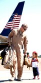 Lt. Col. Norman "Buddy" Czubaj walks with his daughter, Arianna, on the Charleston AFB flightline after arriving home Sept. 3. The 14th Airlift Squadron returned from a four-month deployment to Southwest Asia. Colonel Czubaj is  the 14 AS commander.  (U.S. Air Force Photo/Airman 1st Class Cynthia Spalding)